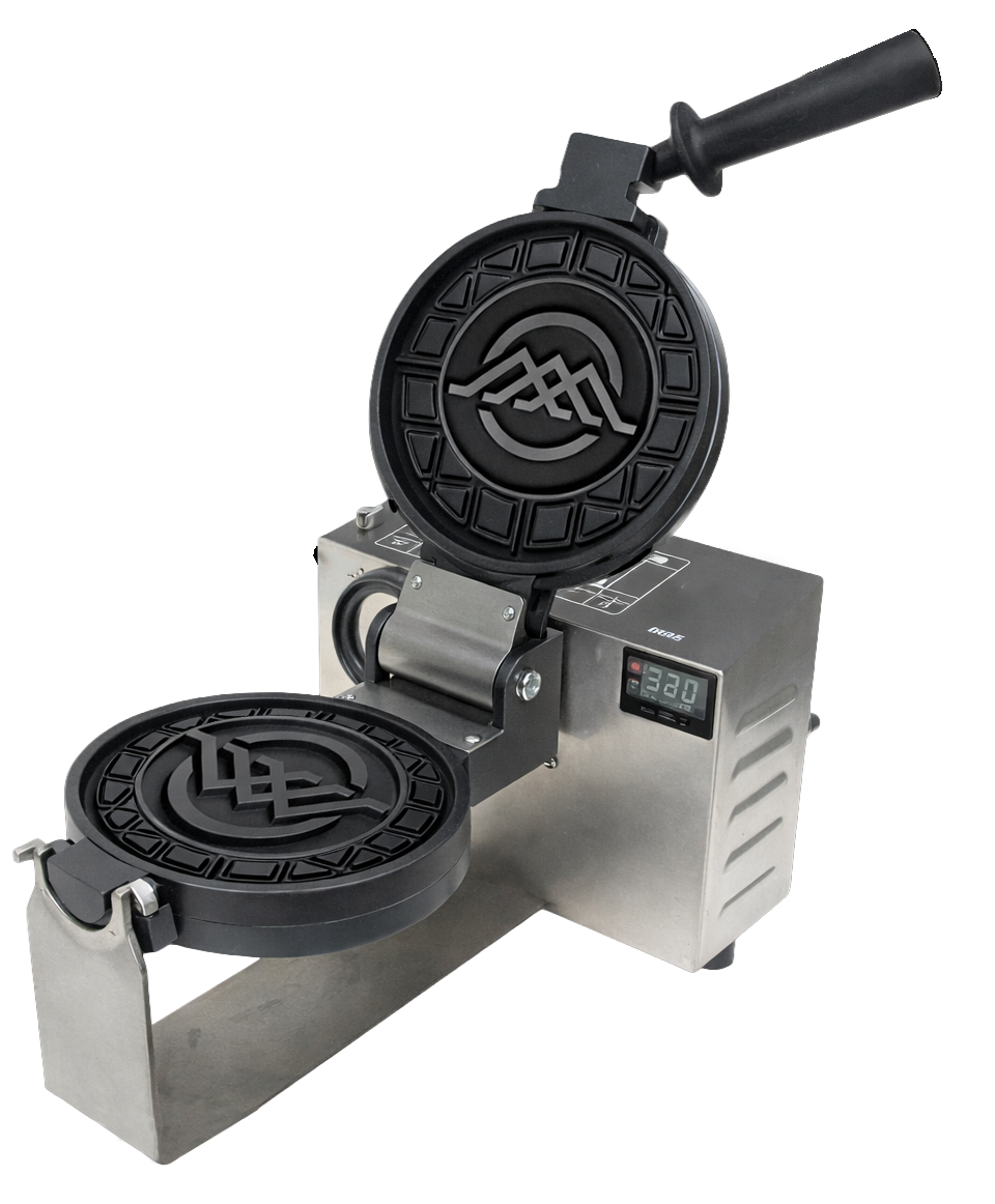 A commercial waffle iron with two round, black waffle plates featuring a logo, set on a stainless steel countertop with a digital temperature display.