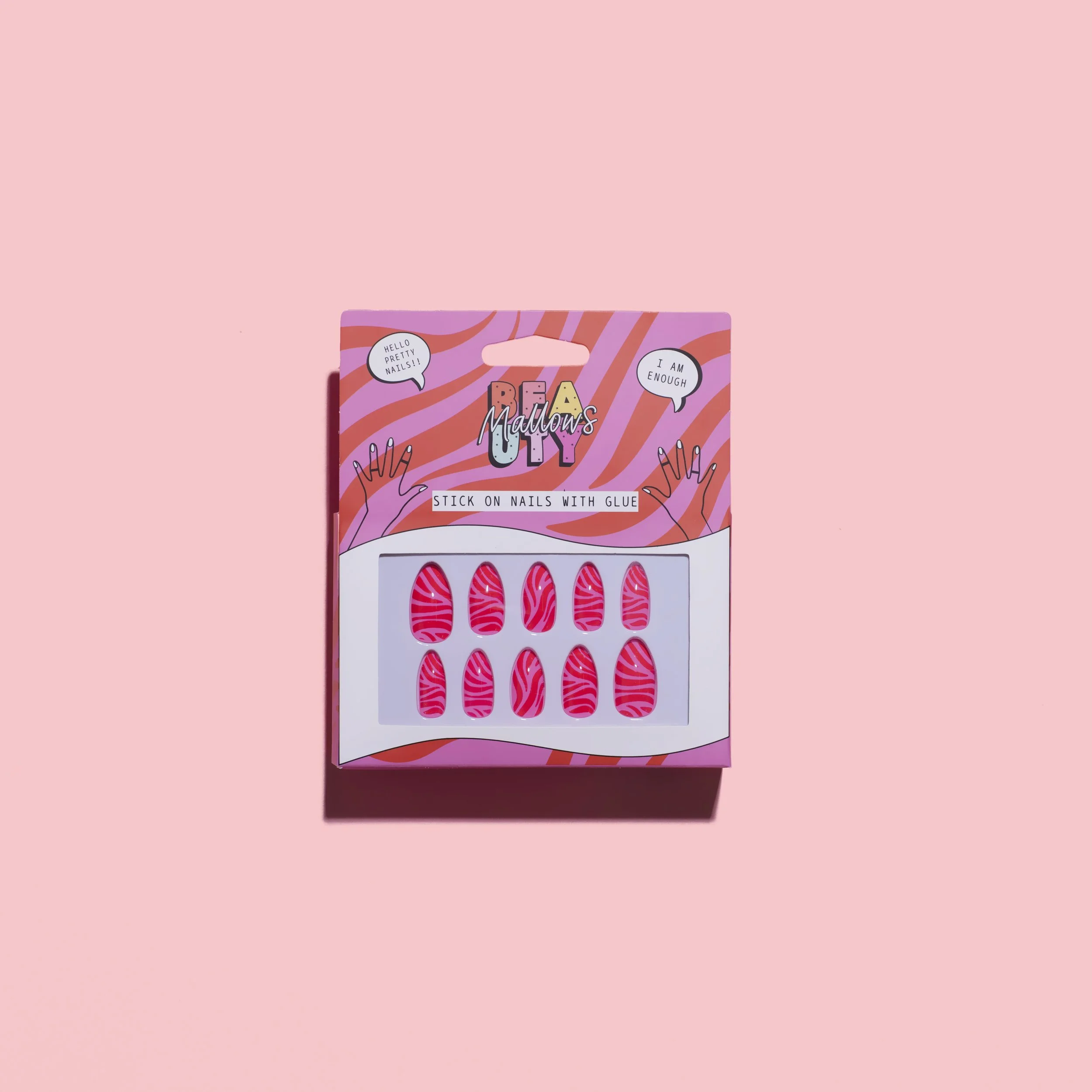 Box of colorful zebra-striped nail stickers with pink and red patterns on a pink background.