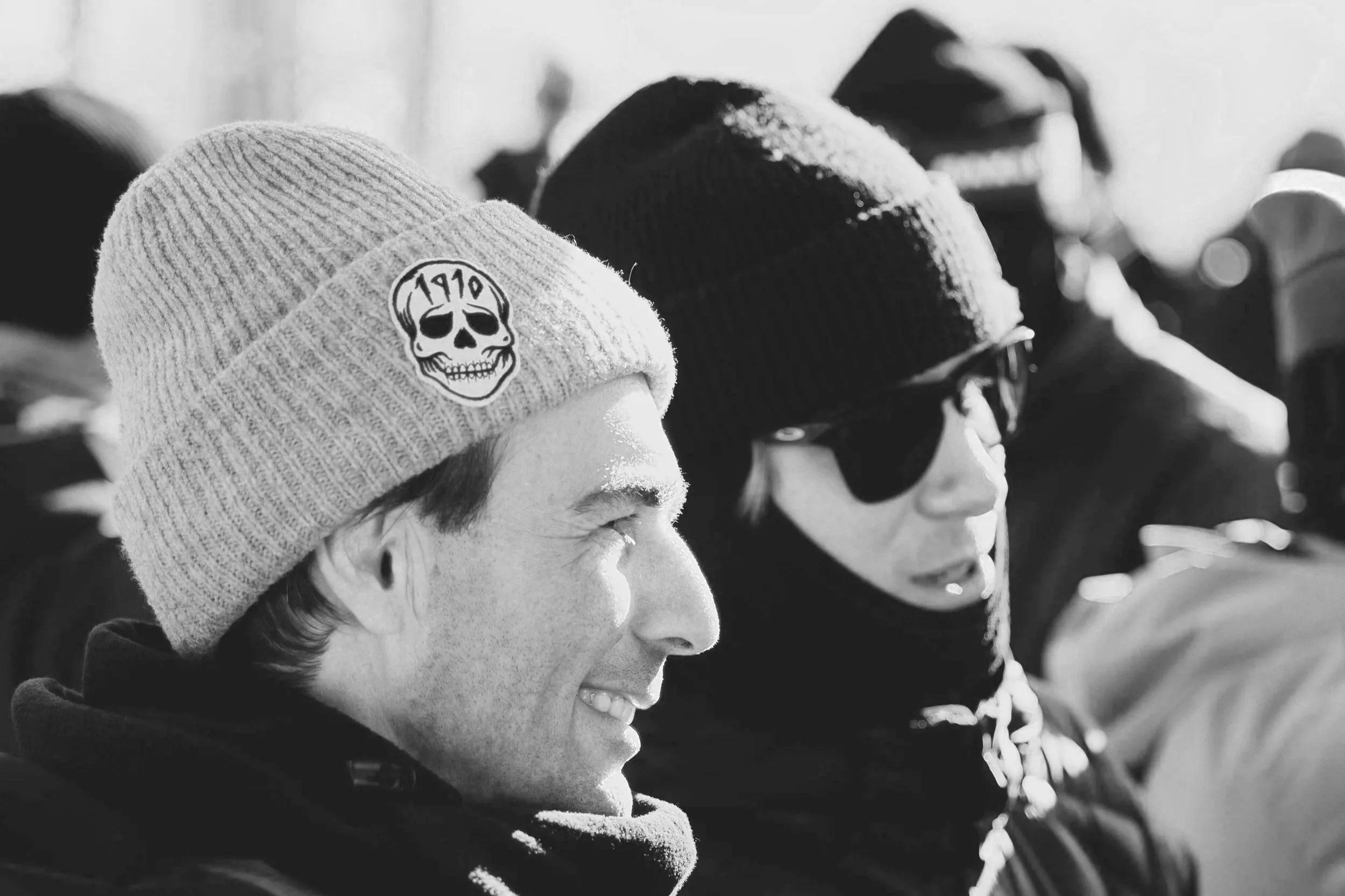 Geometric drawing of an outline square with sections divided by vertical, horizontal, and half circle lines.