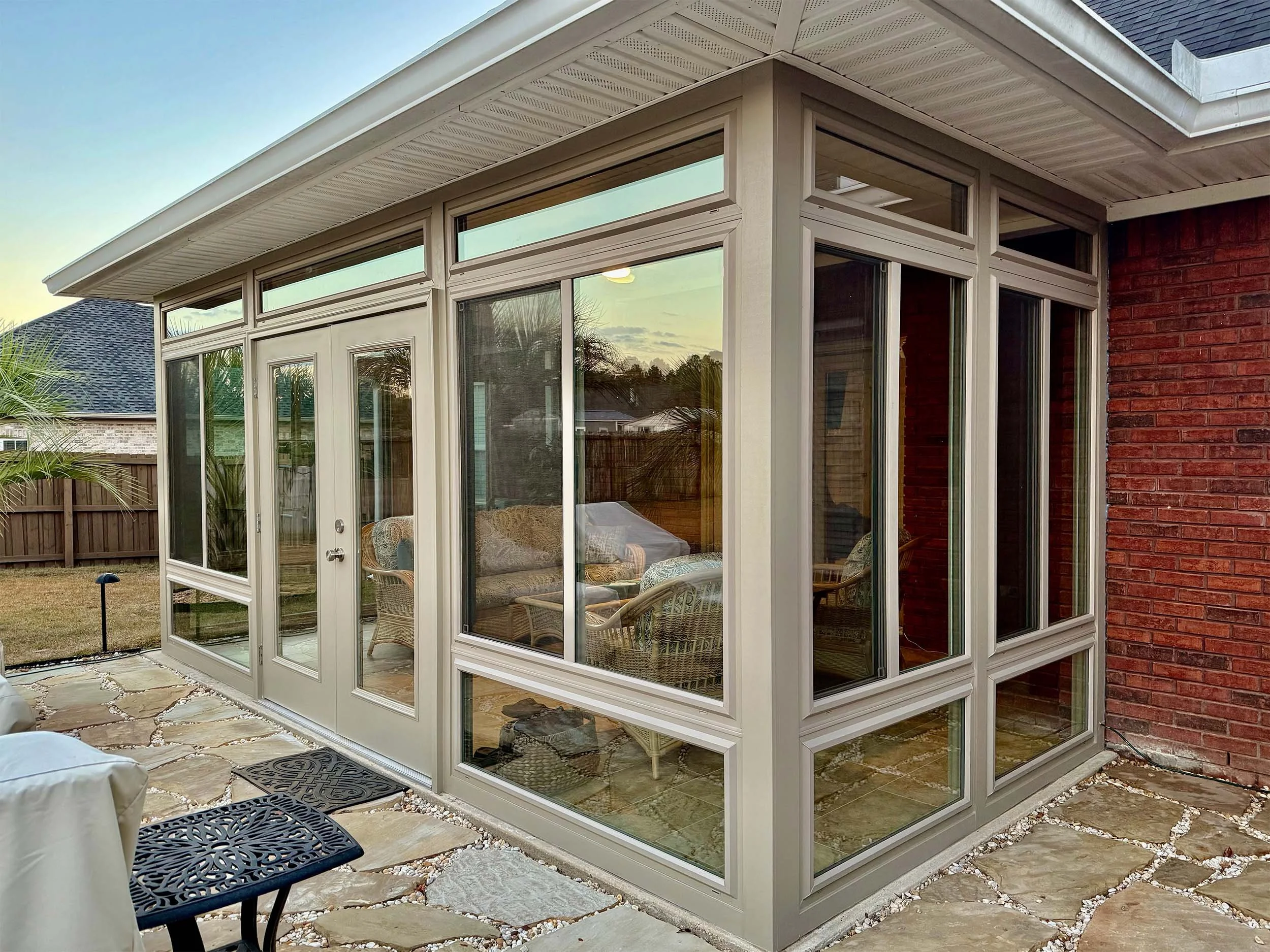 Enclosed patio and sunroom space designed for relaxed outdoor living.