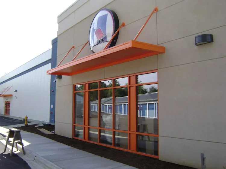 Commercial awning installation designed to enhance branding and building appearance.