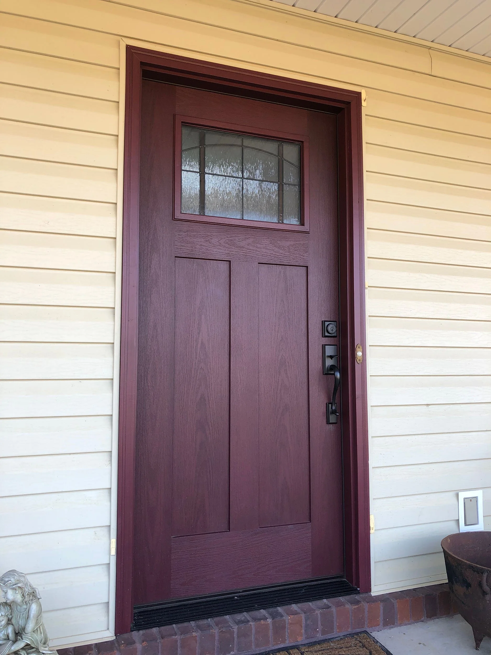 Custom entry door installation designed to complement the home’s exterior.