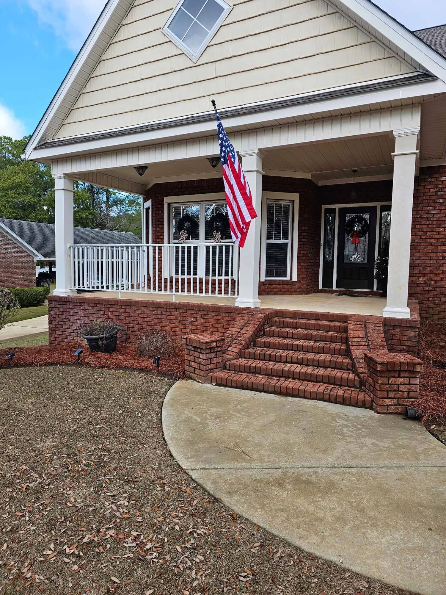 Outdoor handrail installation for a safer and more finished home entrance.