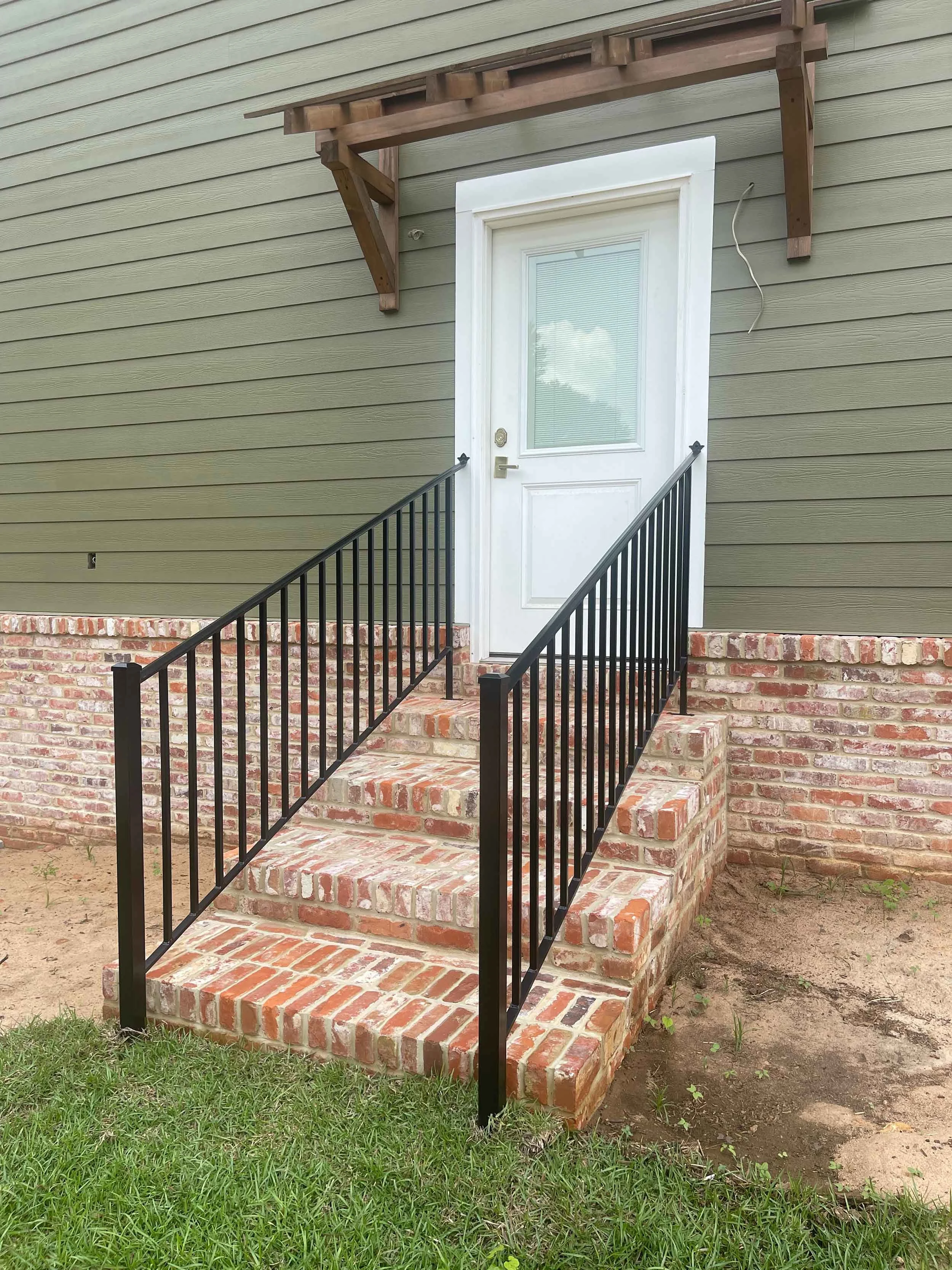 Custom handrail system designed for safe and comfortable access to the home.