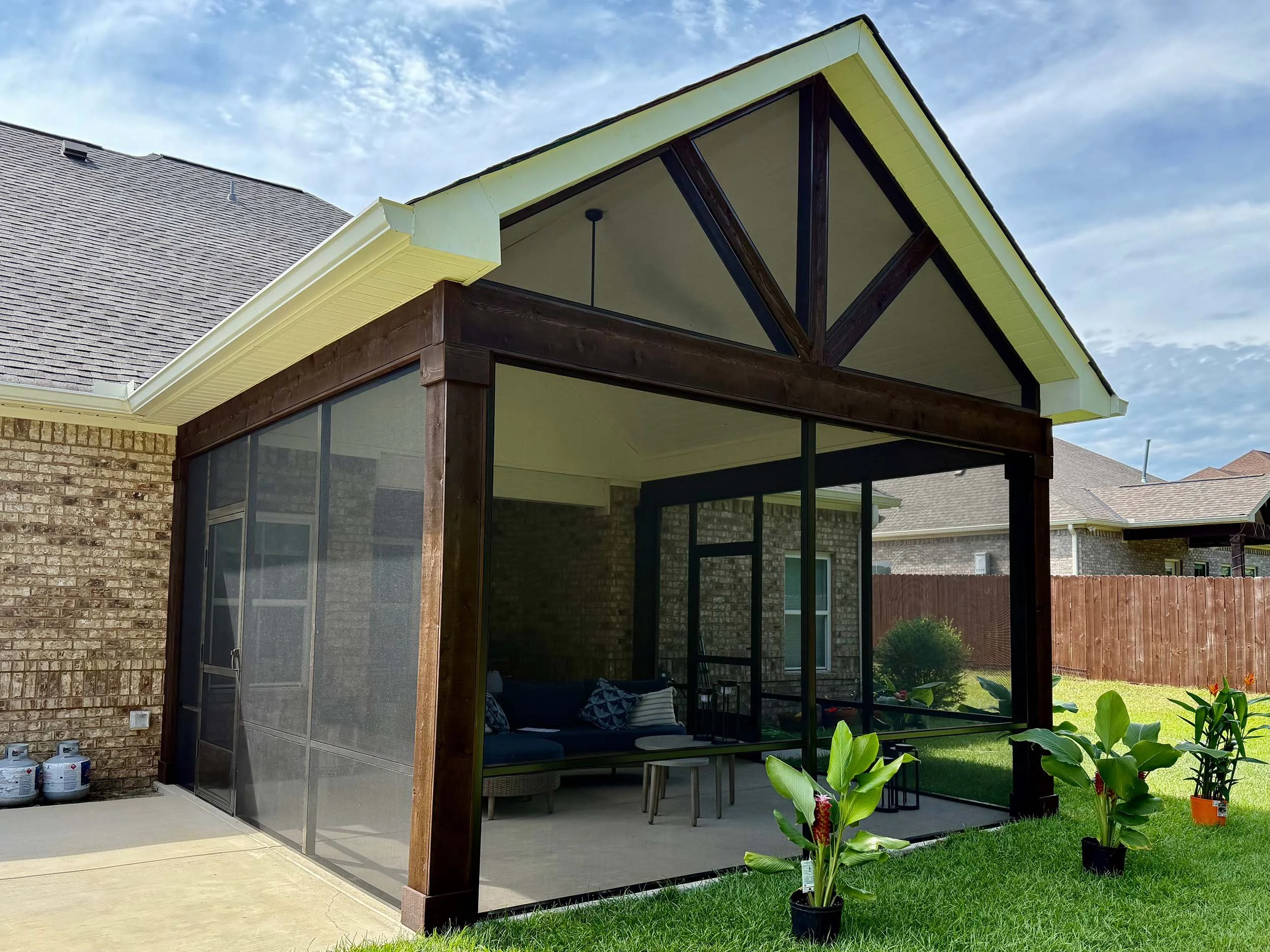 Screened porch enclosure built for relaxing and entertaining outdoors.