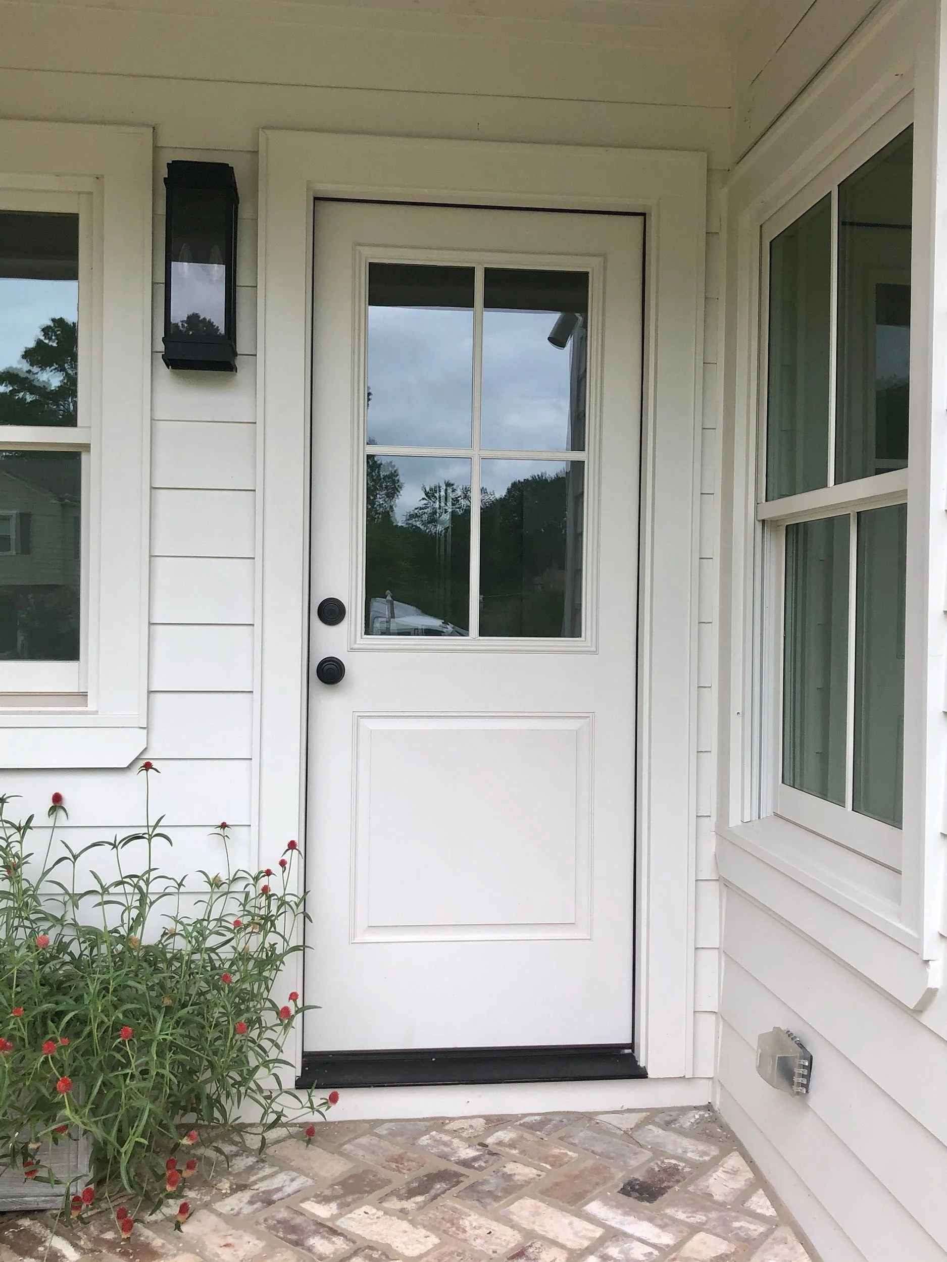 Replacement door installation for a residential home in the Dothan area.