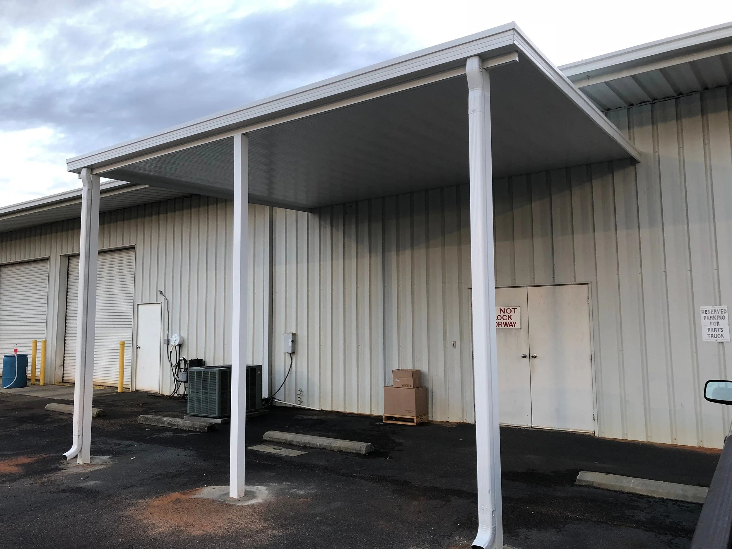 Commercial awning installed to enhance a business entrance and exterior appearance.