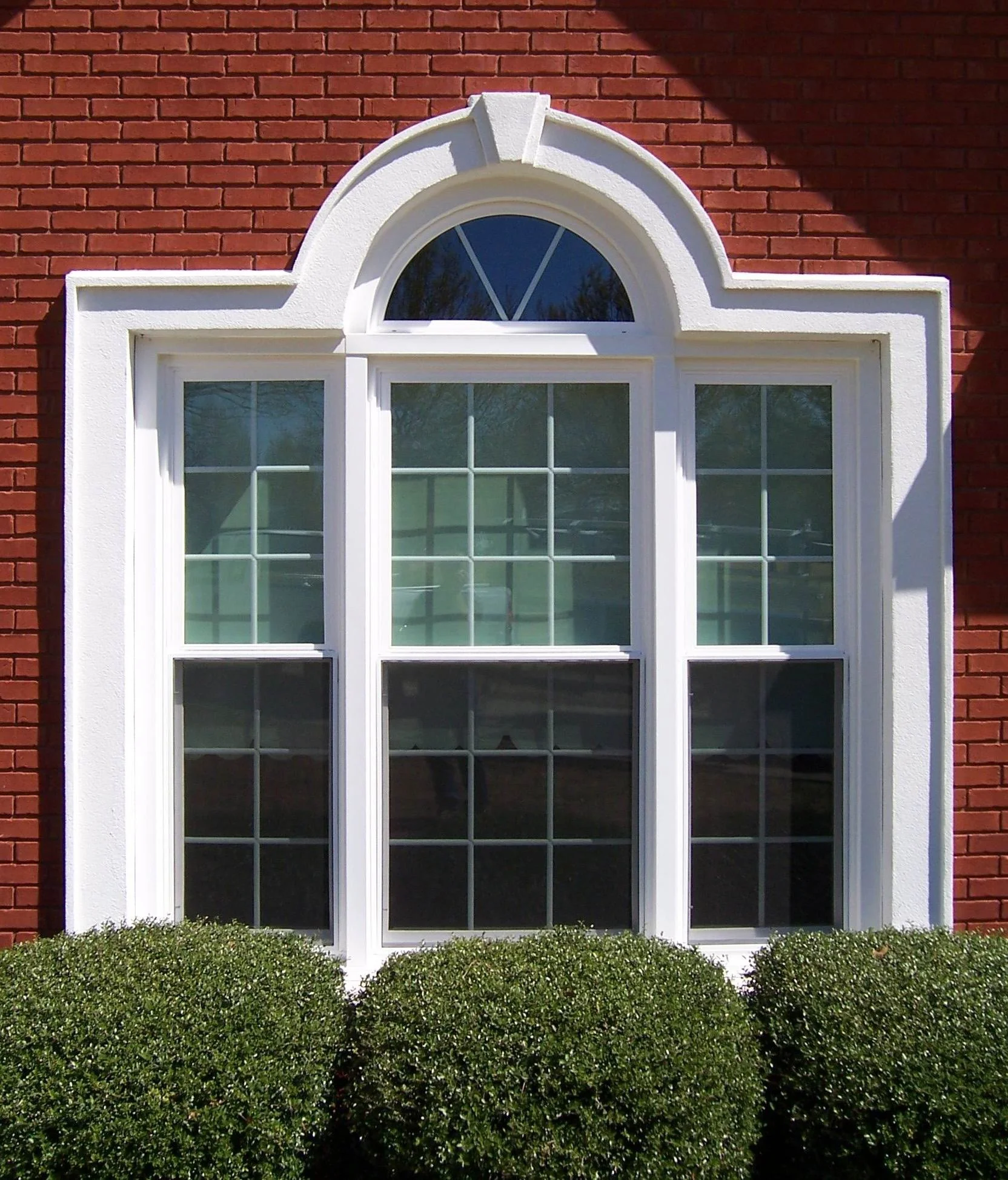 Replacement windows installed on a brick home in the Dothan area.
