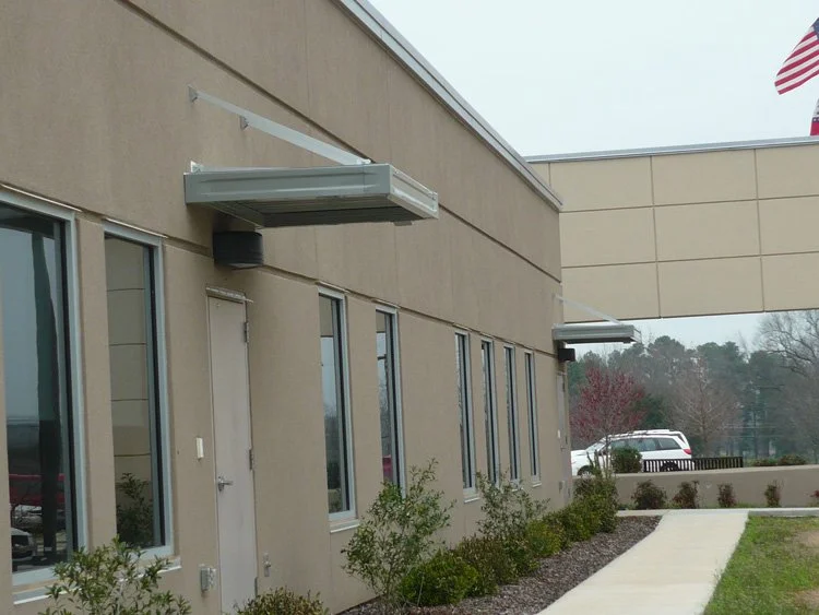 Custom storefront canopy designed to add function and style to a business exterior.