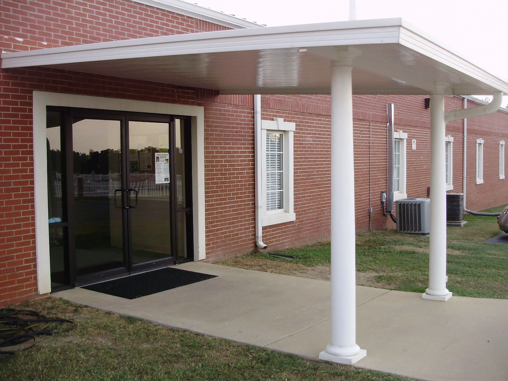 Custom commercial shade solution installed for a storefront or office entry.