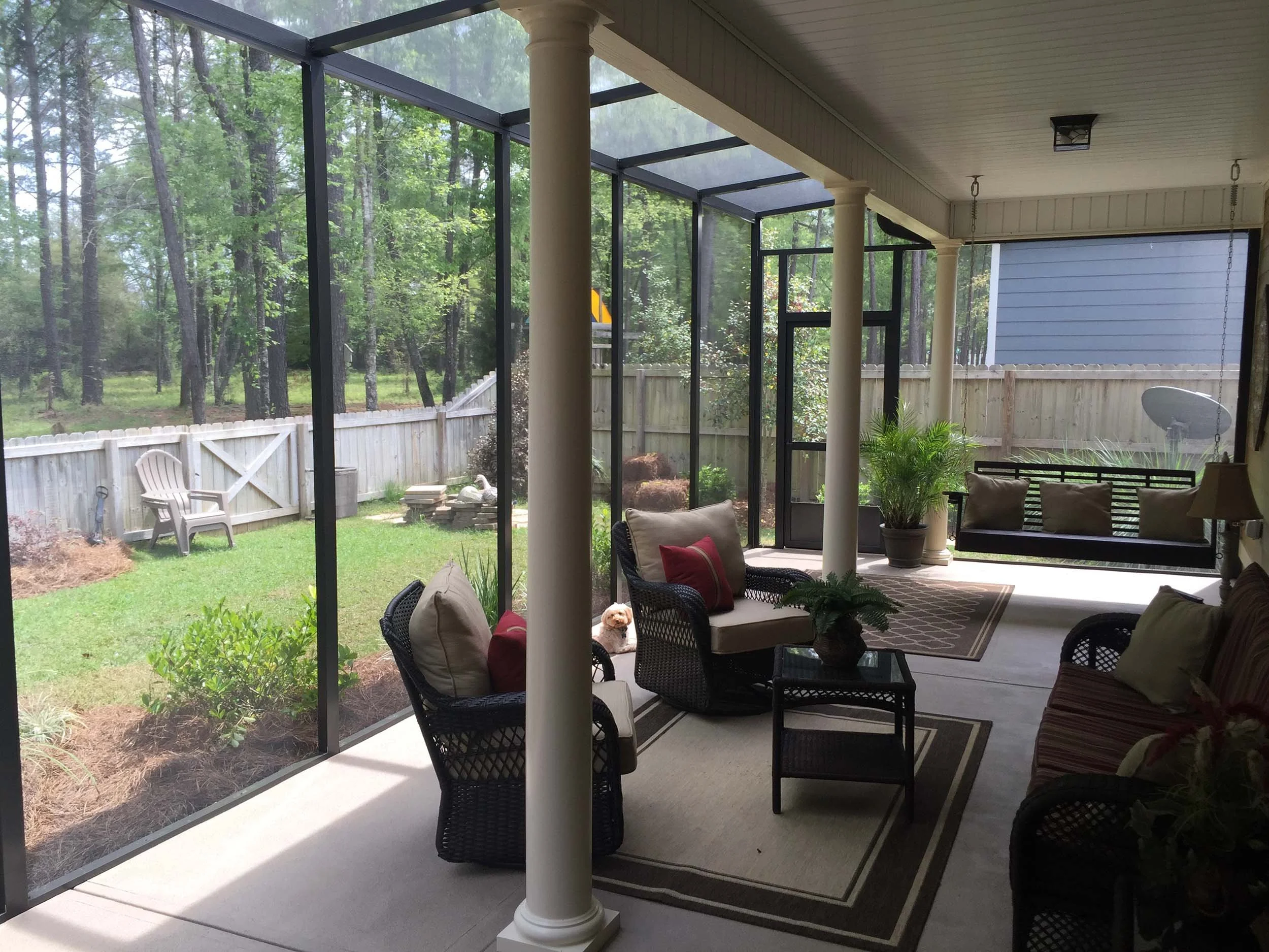 Screened patio enclosure designed to protect against insects and weather.