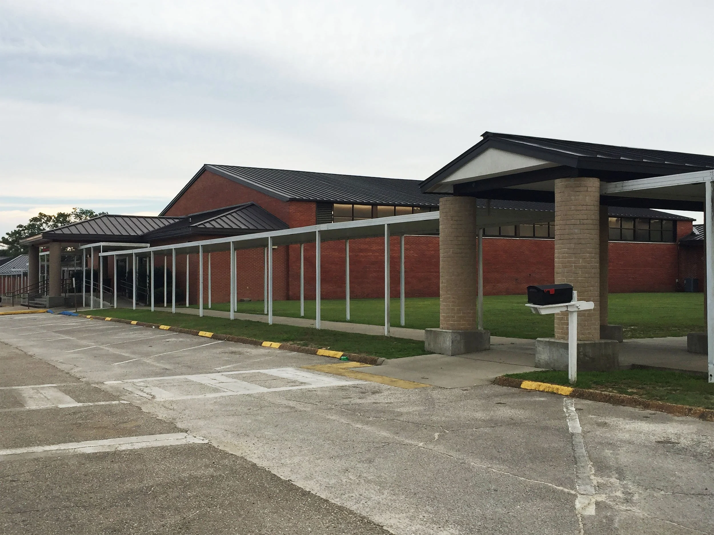 Commercial walkway cover by Hathcock Home Services for safer outdoor access.