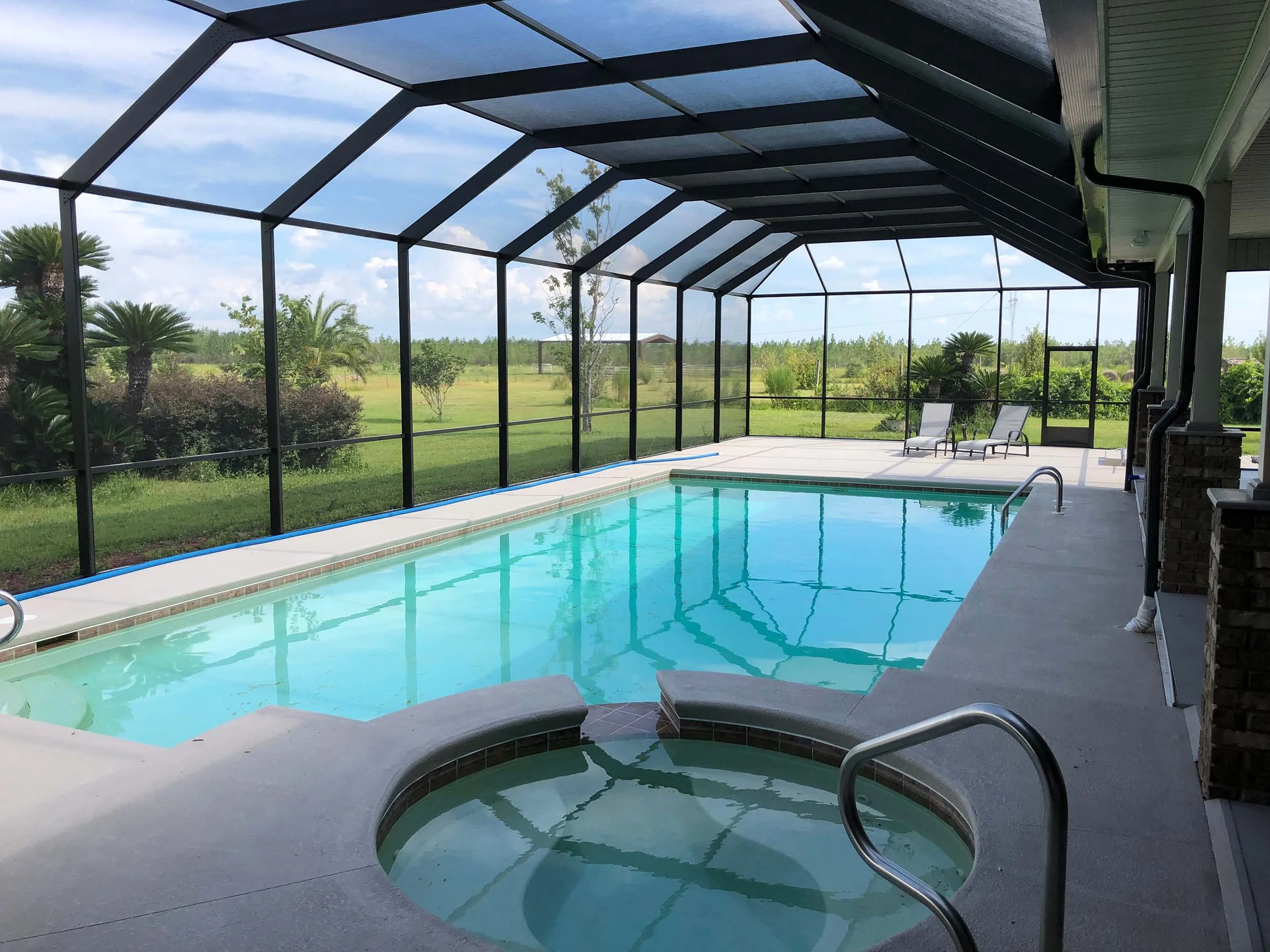 Residential pool enclosure by Hathcock Home Services for added comfort and protection.