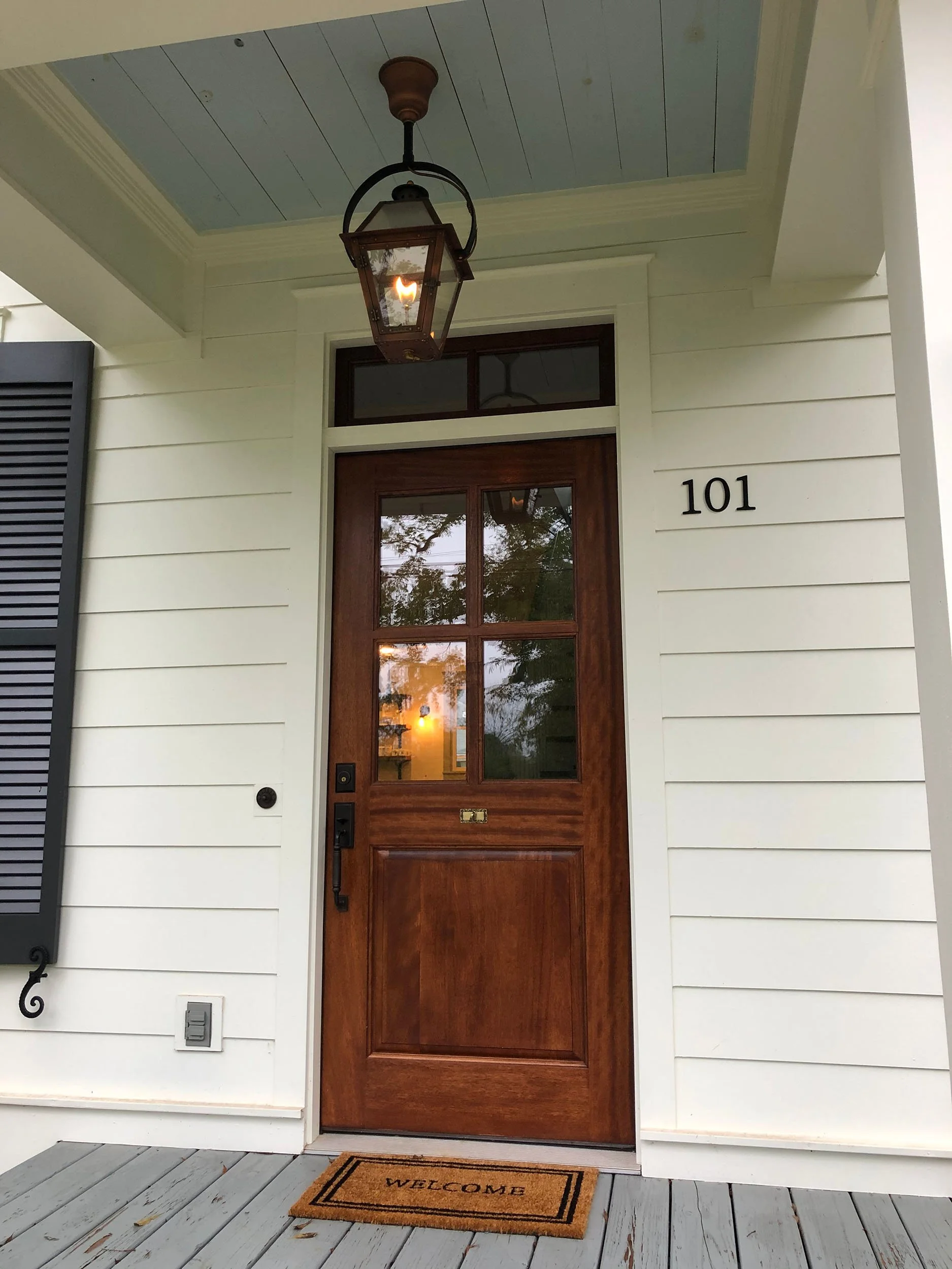 Residential replacement door project with updated trim and improved curb appeal.