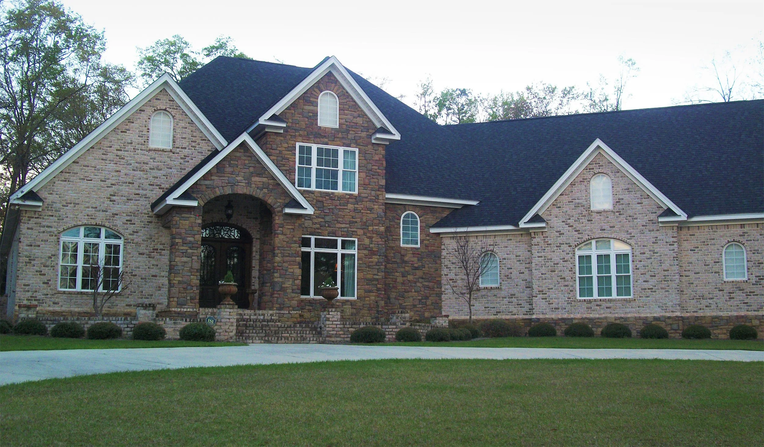 White replacement windows with divided lites for a residential home.