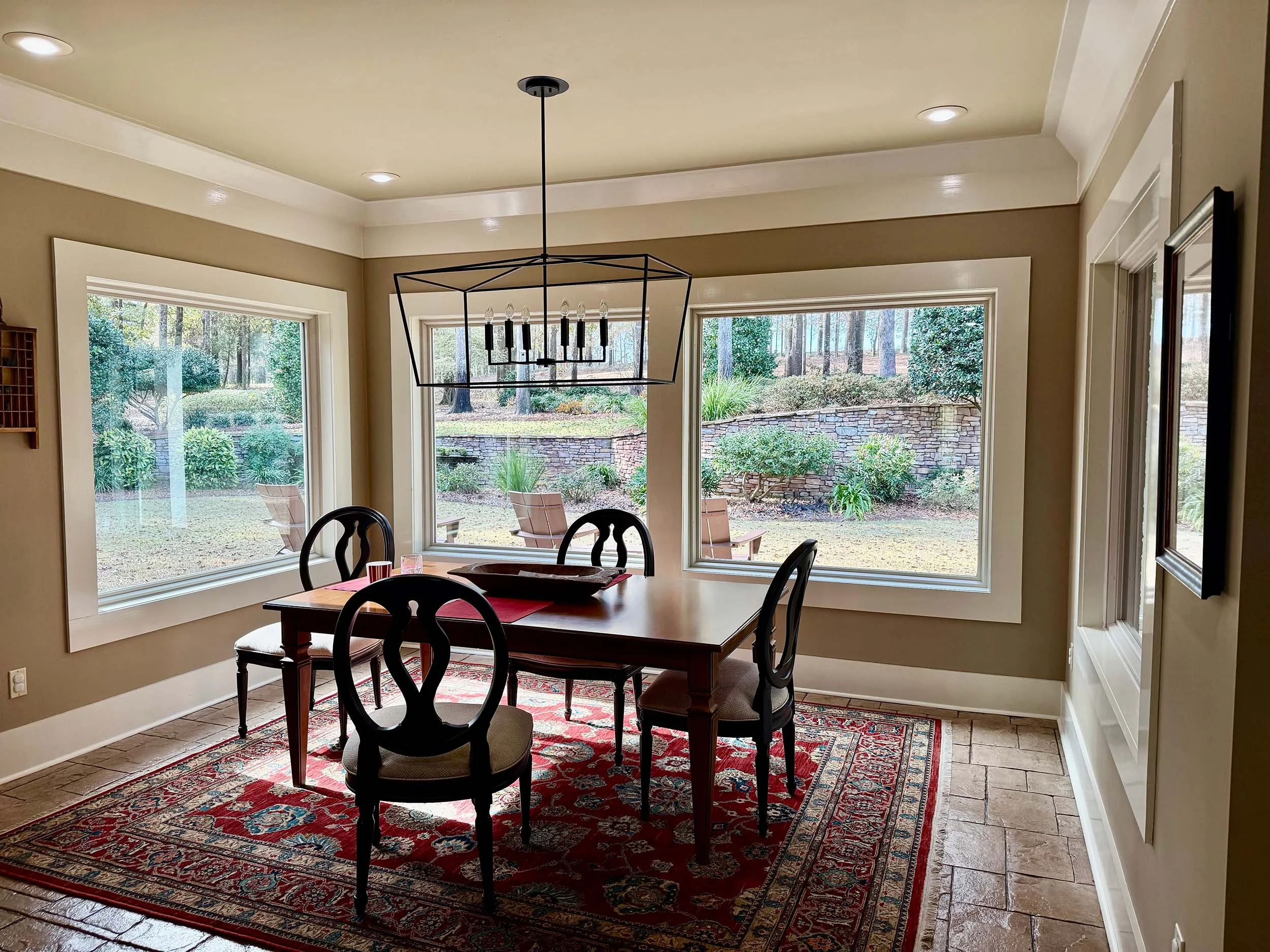 Interior view of replacement windows adding natural light to a dining space.