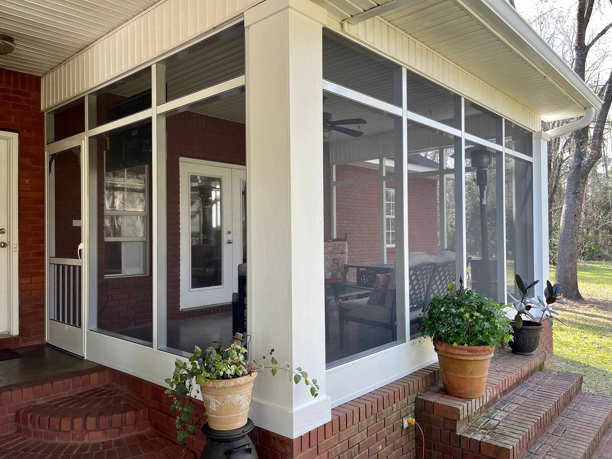 Screenroom installation designed for shaded outdoor seating and entertaining.