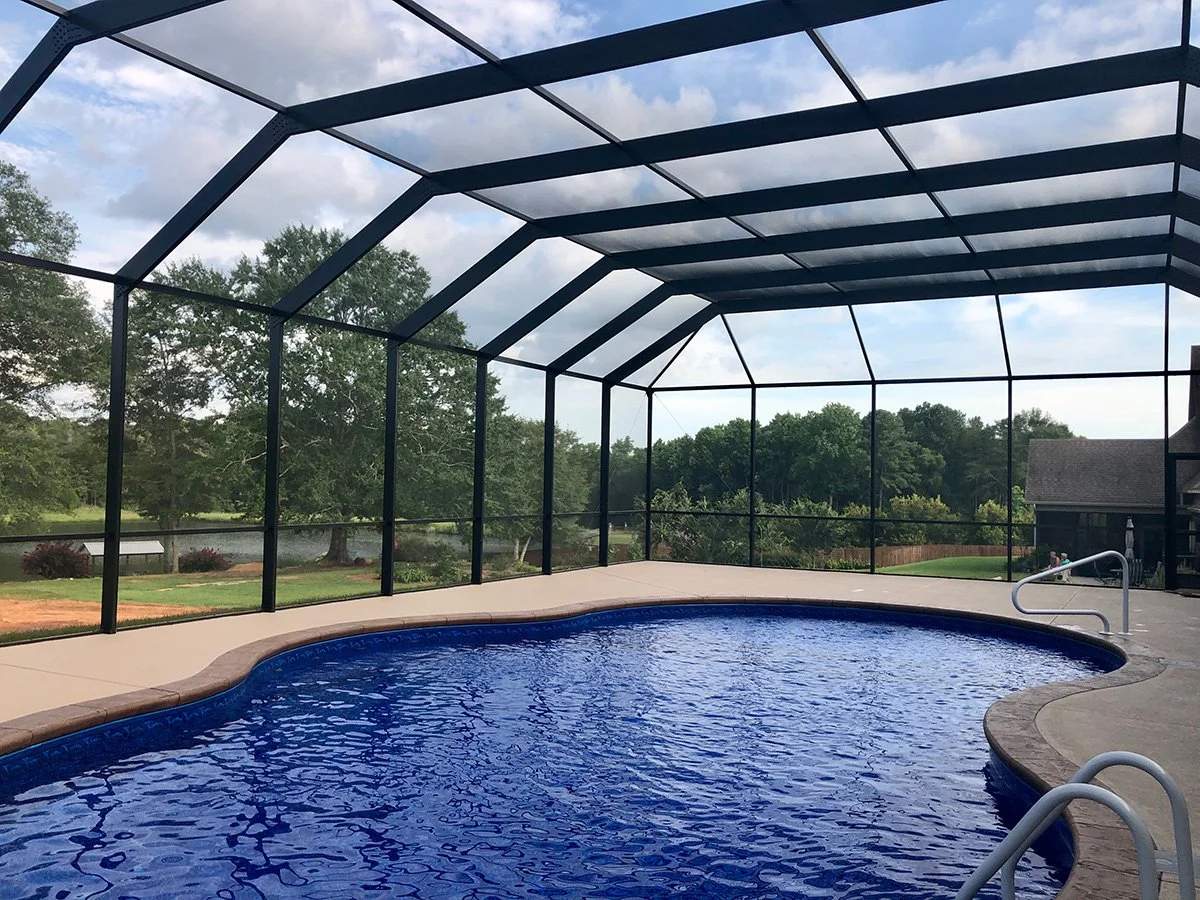 Pool cage installation designed to protect and enhance an outdoor pool space.