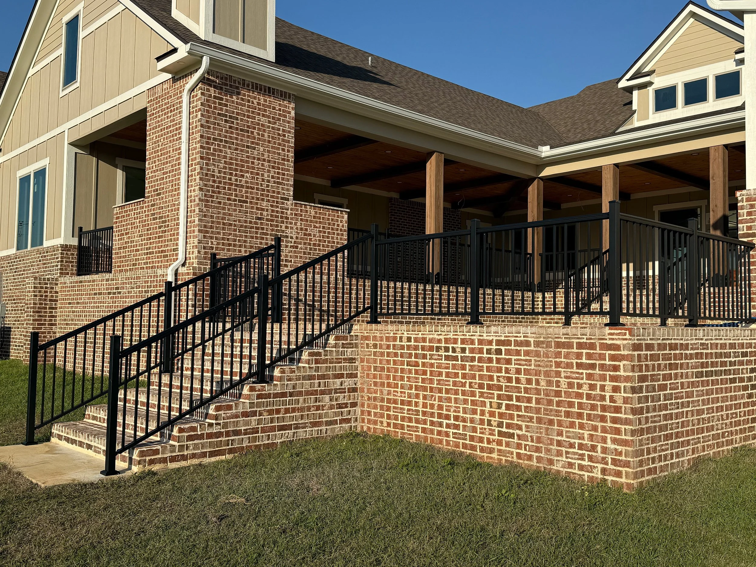 Durable railing installed along residential steps for added support.