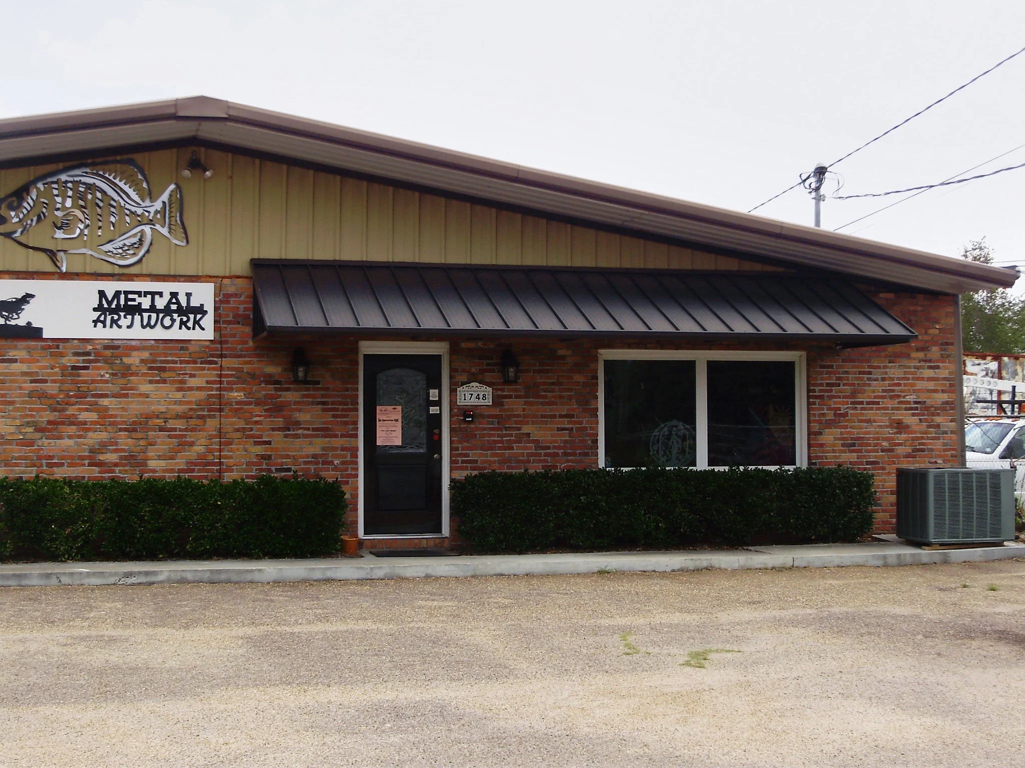 Custom commercial awning installation for a business in the Dothan area.
