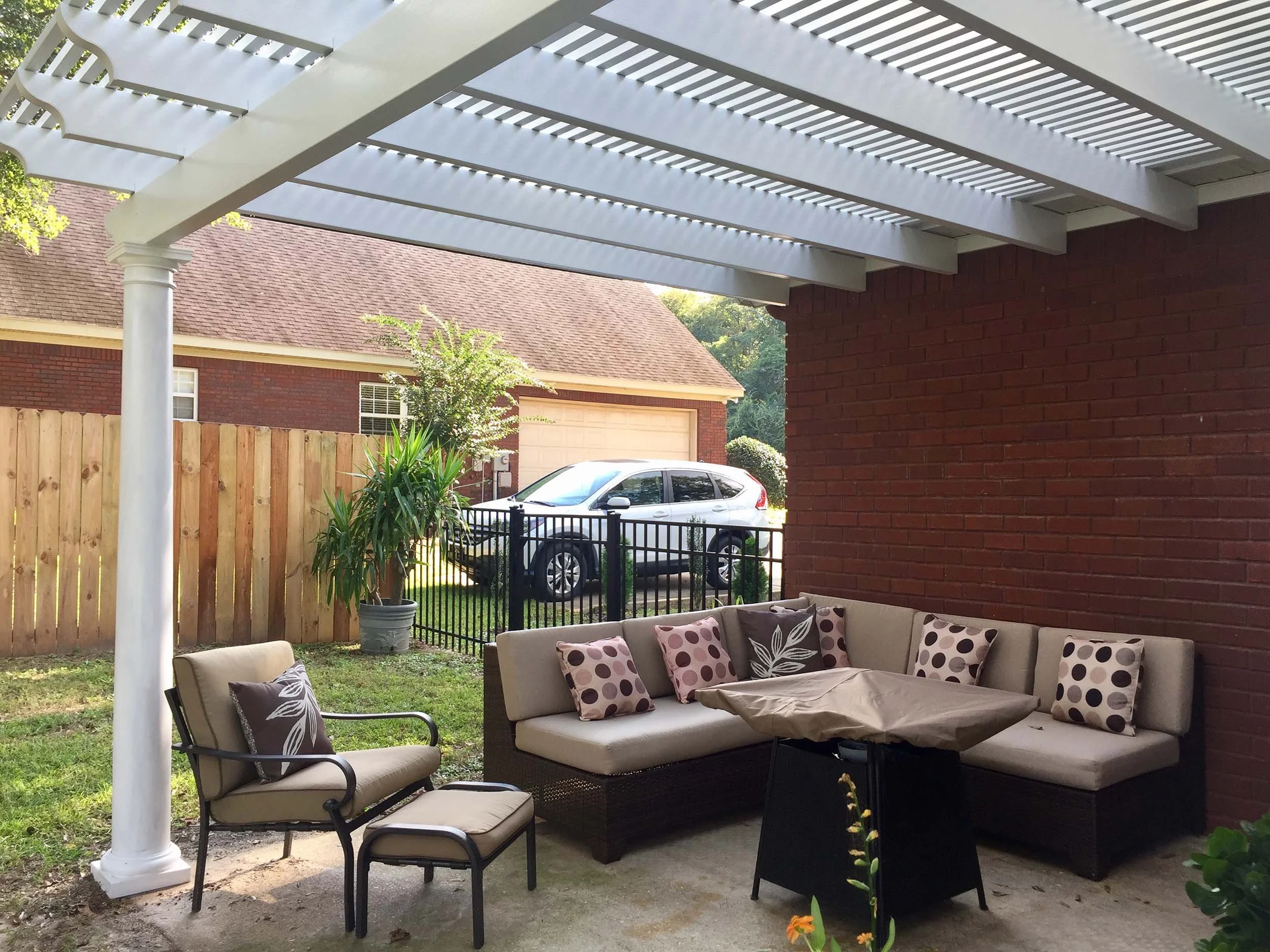 Custom pergola structure built to define and enhance a patio area.