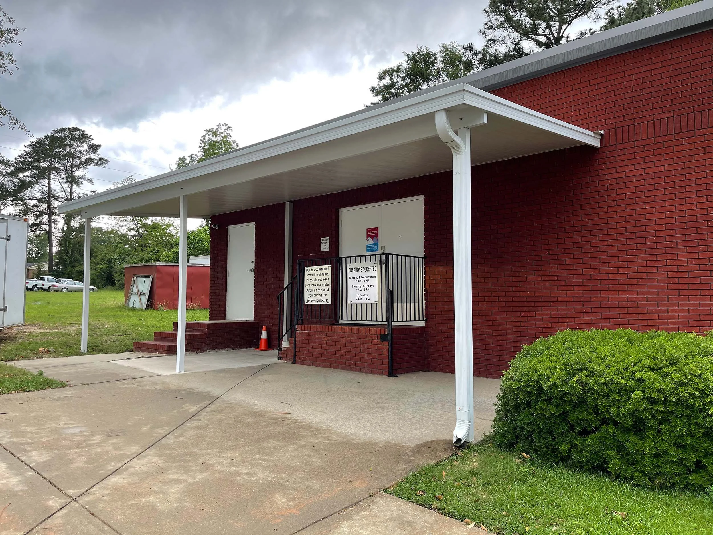 Durable awning system designed for shade and weather protection at a commercial property.