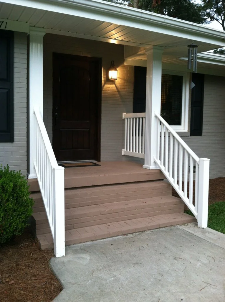 Exterior railing installation designed to complement the home’s entryway.