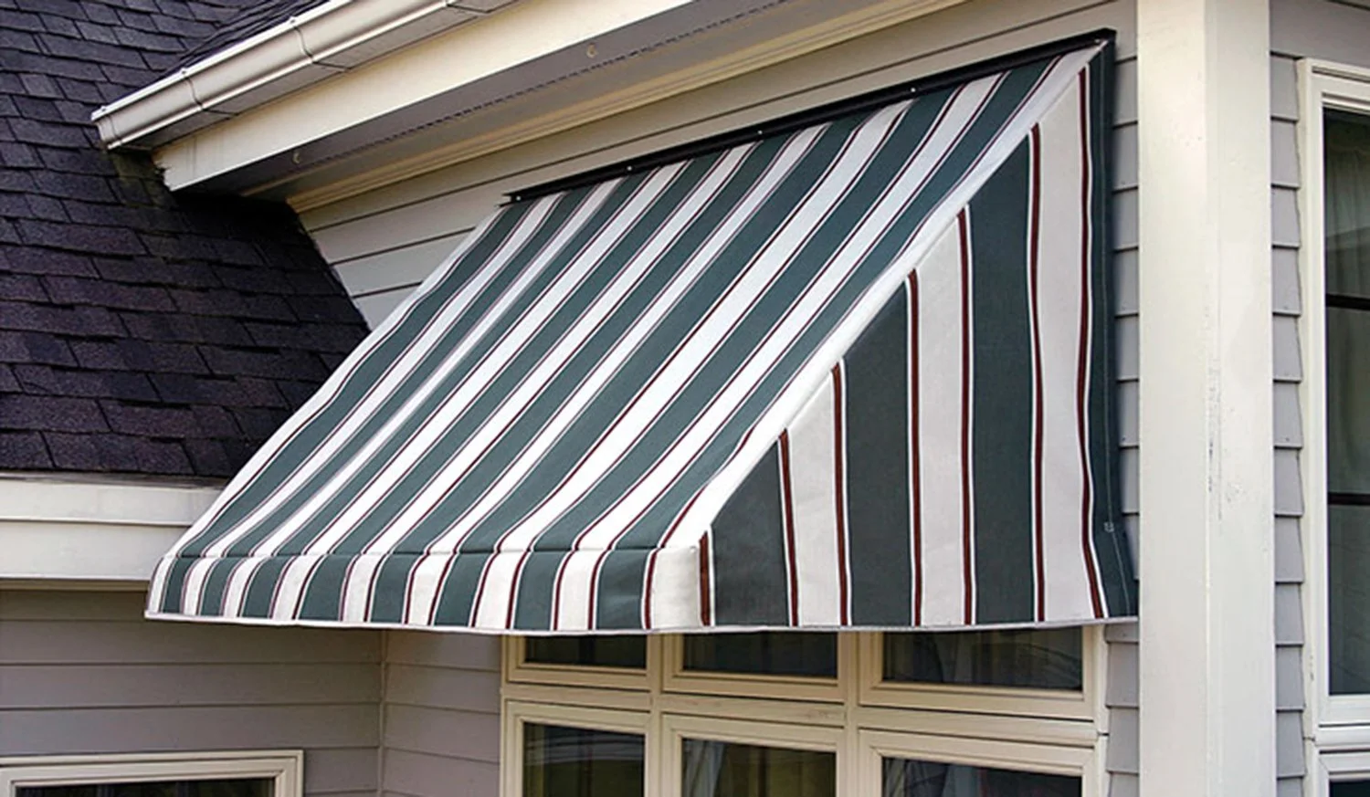 Custom door awning installed over a residential windows.