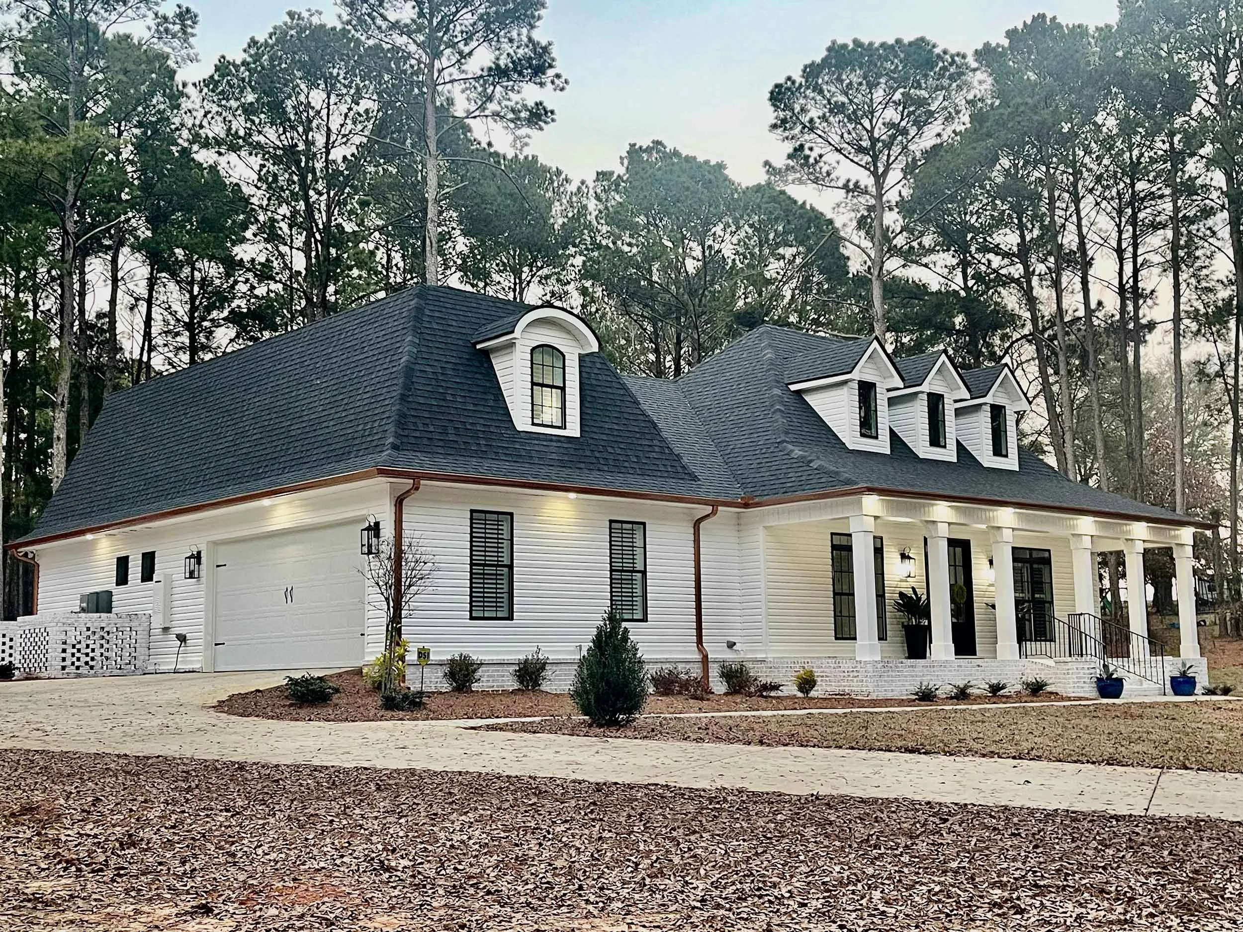 Seamless gutters and downspouts installed for improved water management.