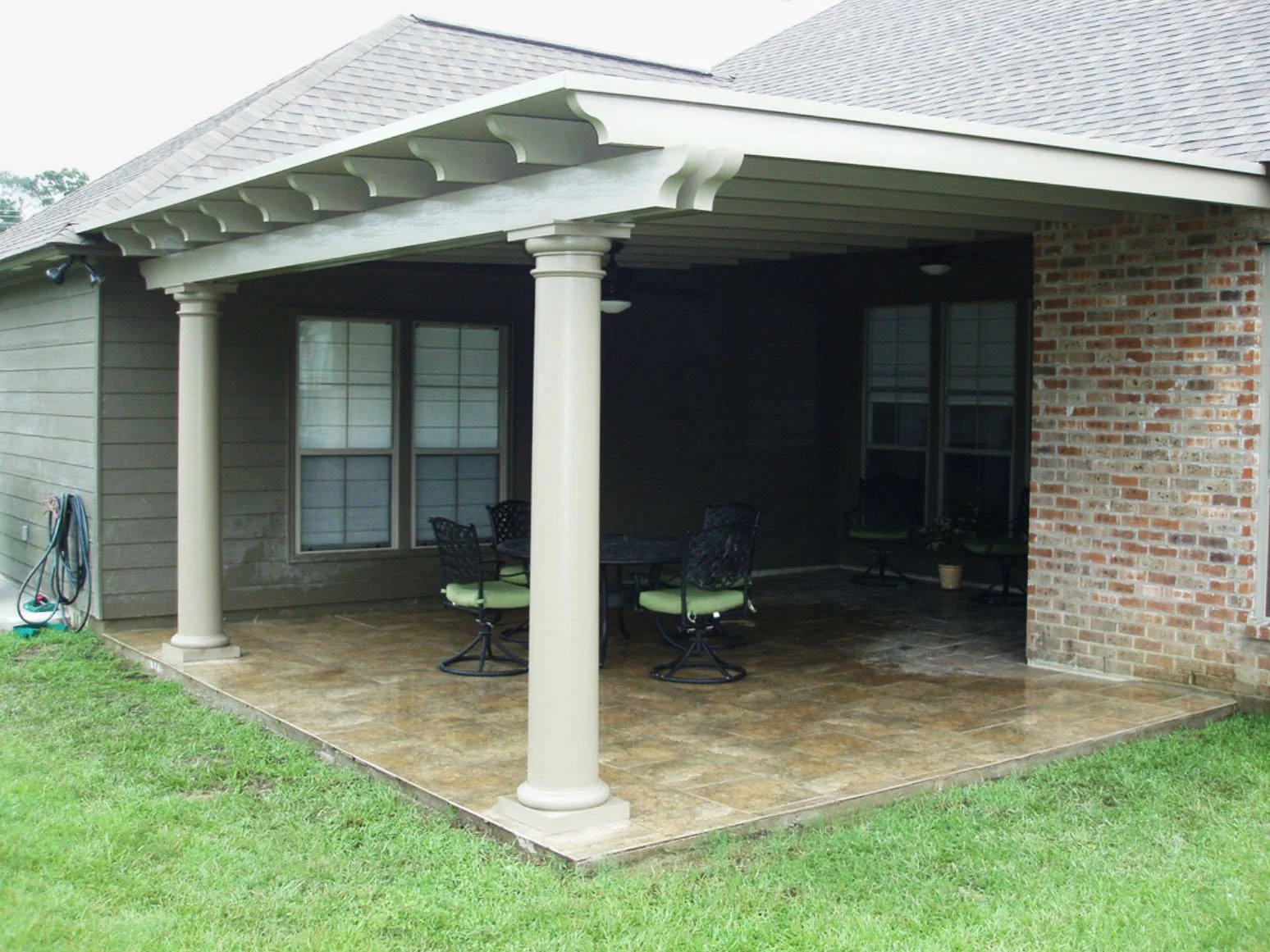Patio cover installed to add shade and function to a backyard space.