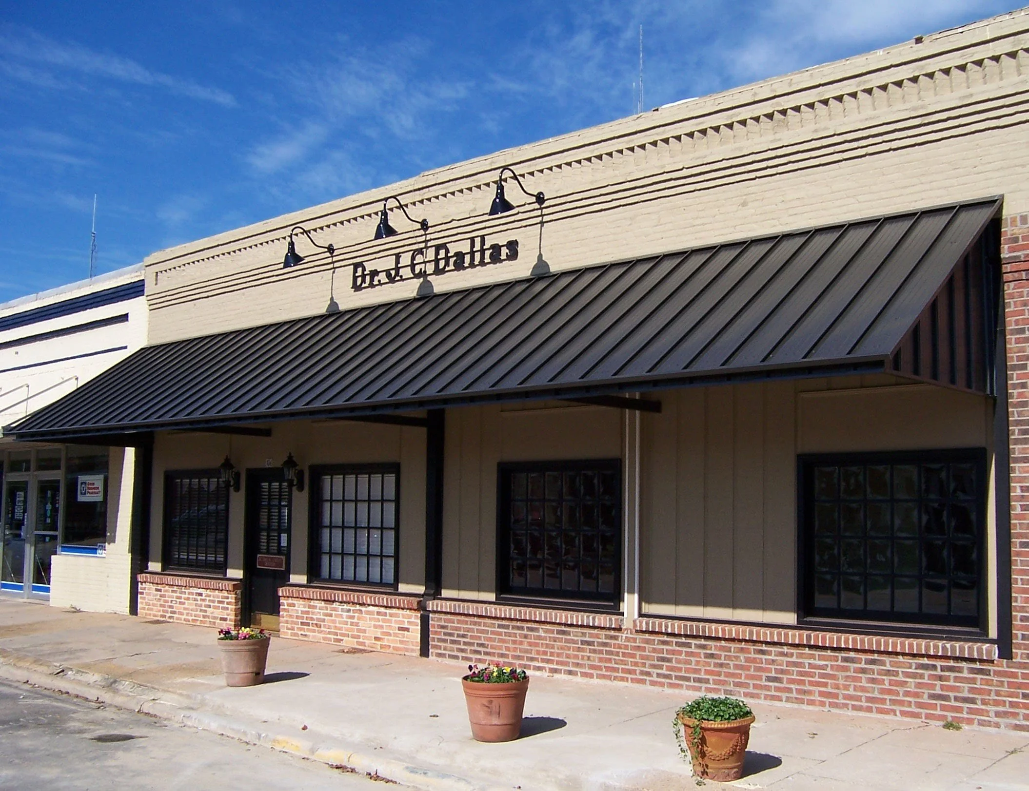 Business awning installation by Hathcock Home Services for a professional exterior.