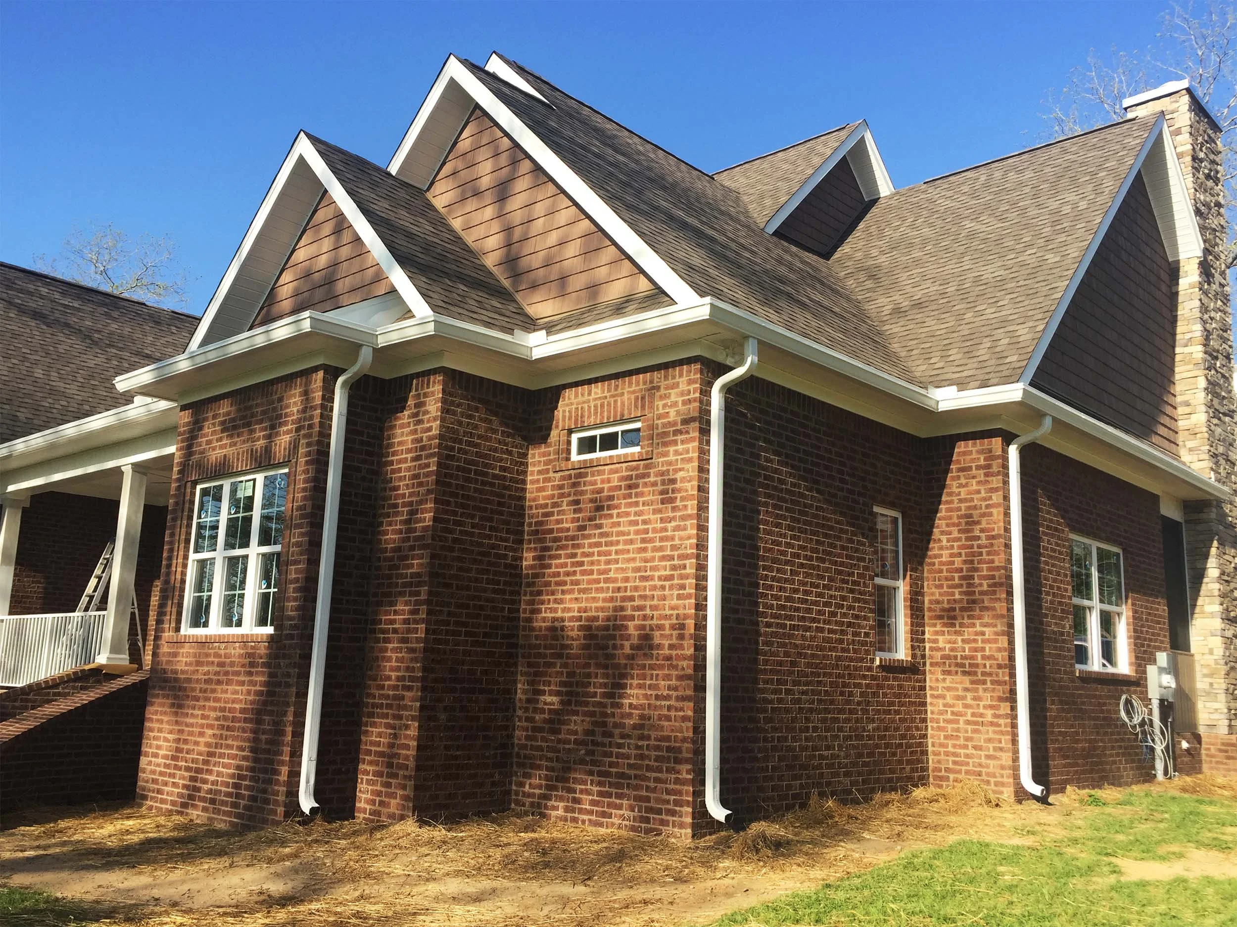 Seamless gutter and downspout installation for a Dothan-area home.