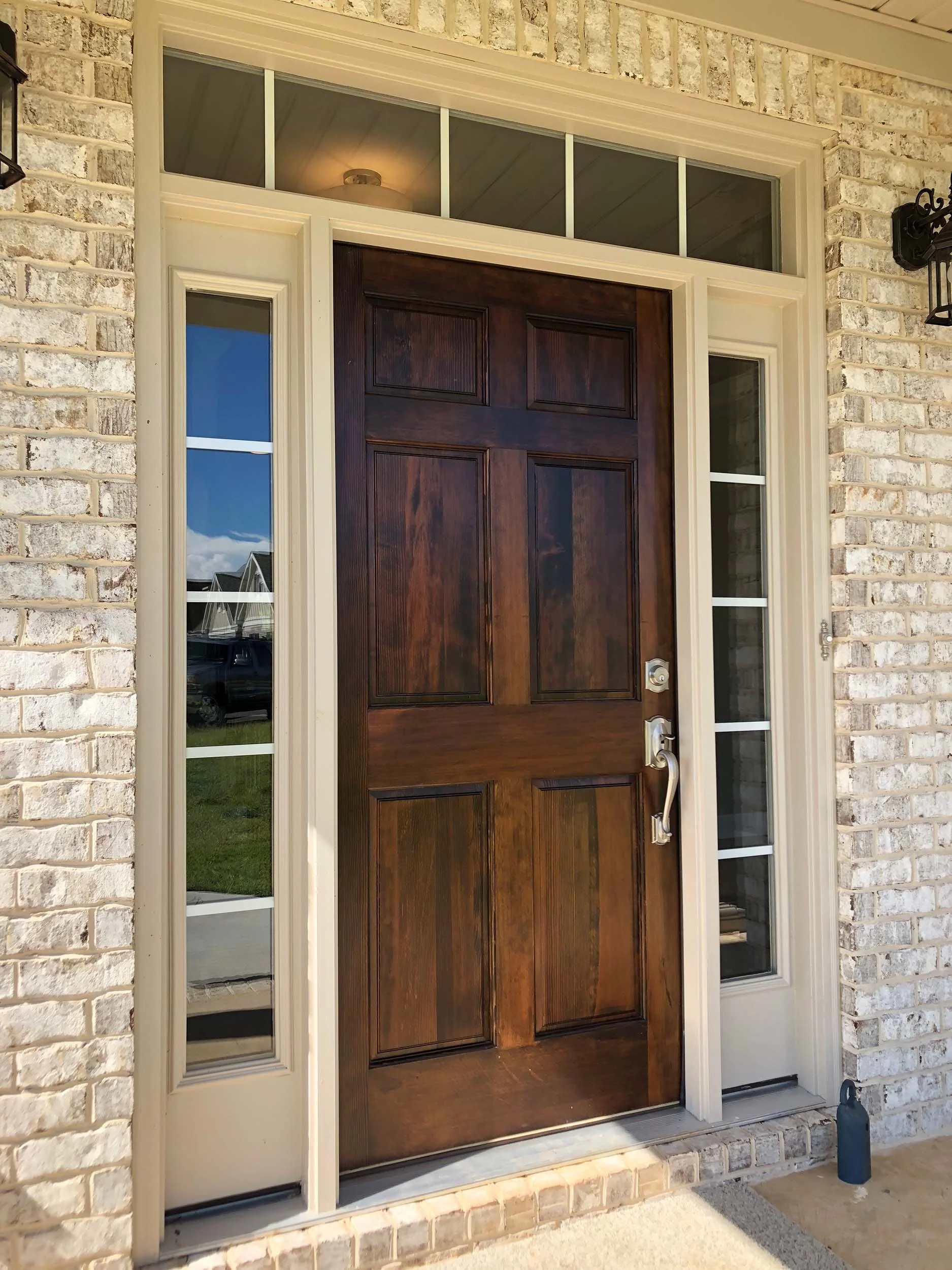 Replacement entry door installed to improve home comfort and exterior style.