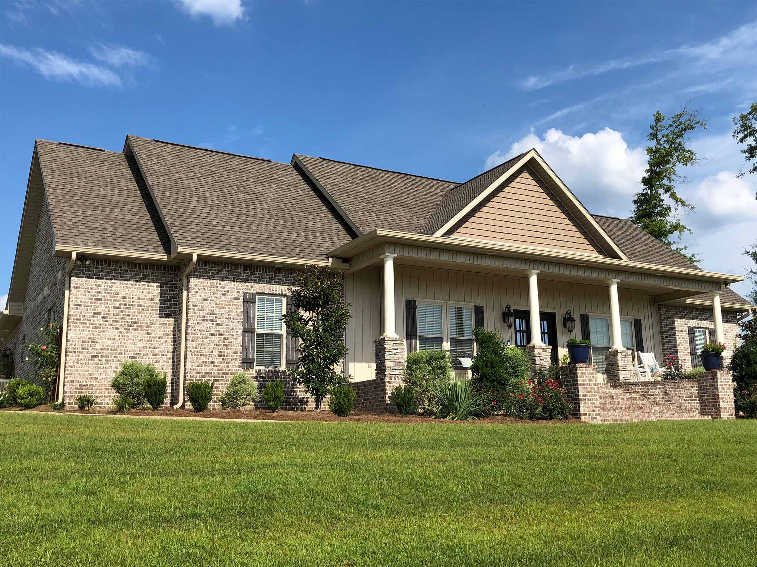 Custom-fit seamless gutters on a traditional home exterior.