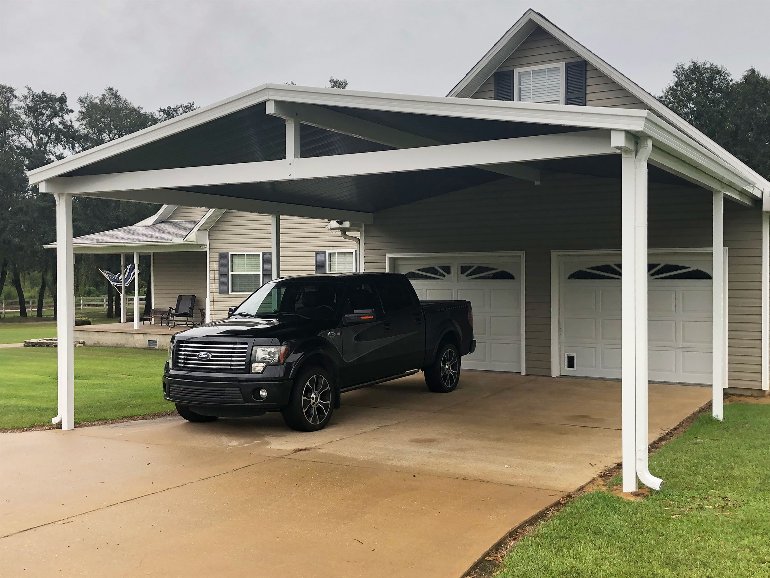Residential carport by Hathcock Home Services for covered vehicle protection.