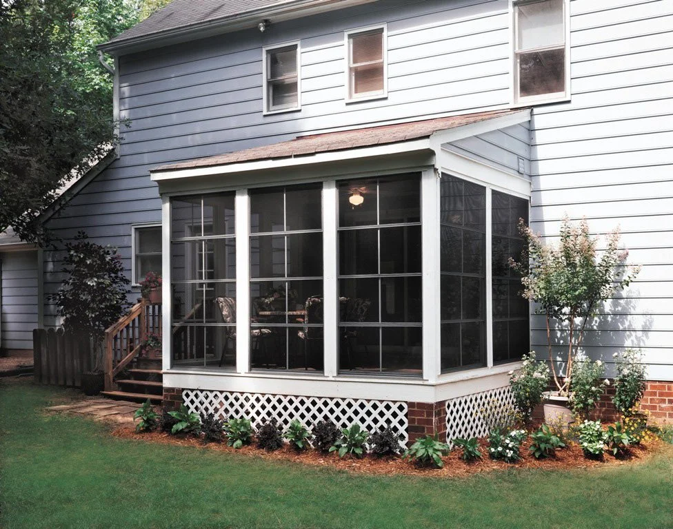 Enclosed porch with EZE-Breeze panels for a comfortable outdoor living space.
