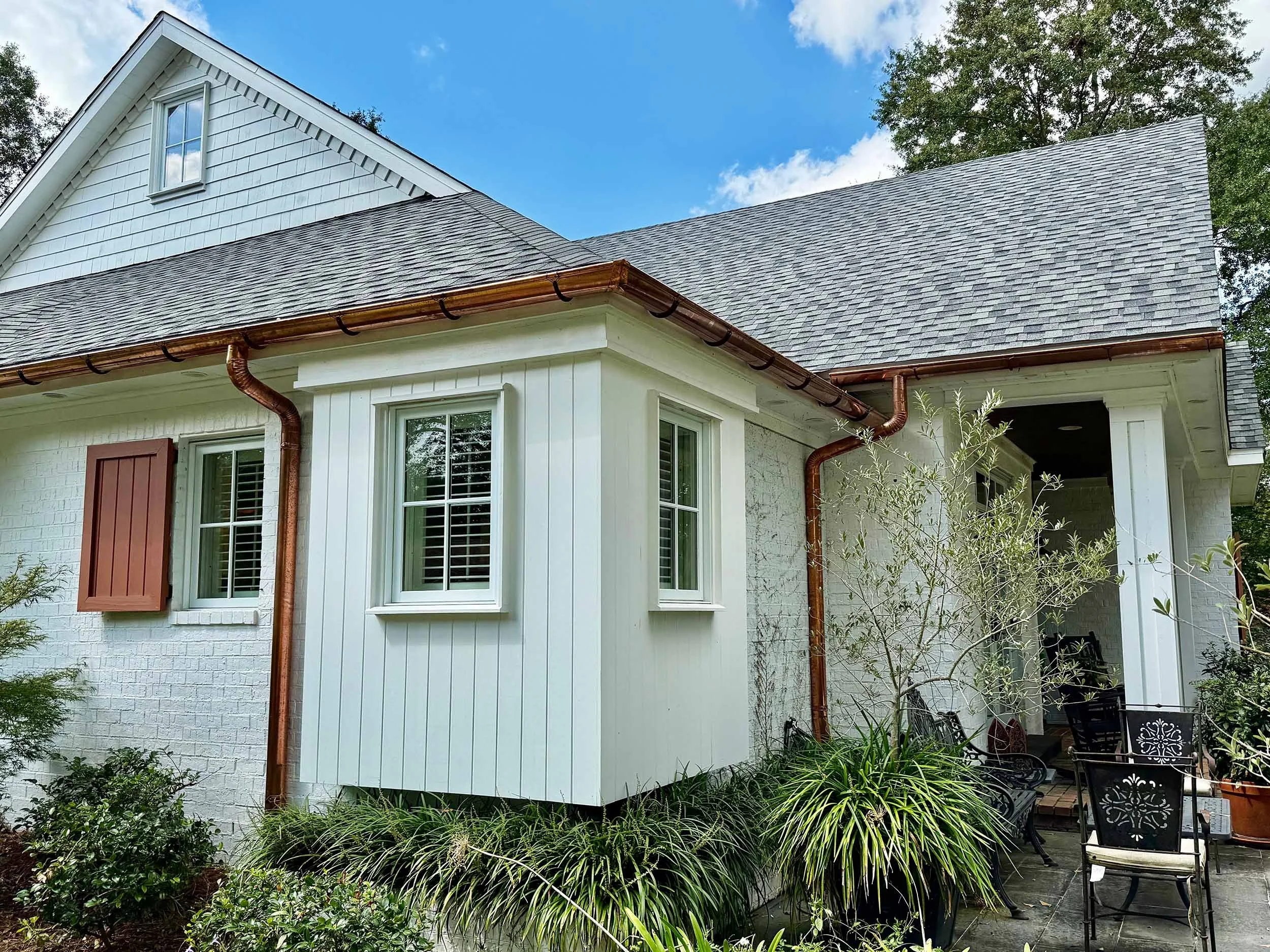 Custom seamless gutters designed to protect a home from water damage.