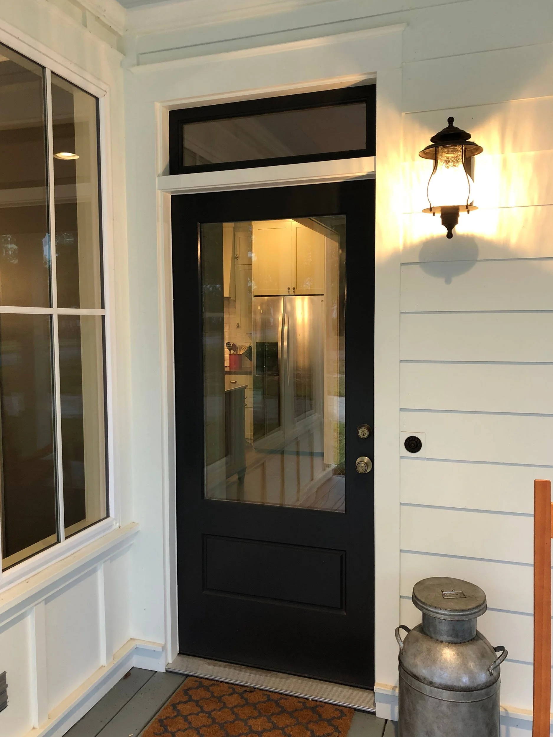 Updated exterior door installation for a traditional residential home.