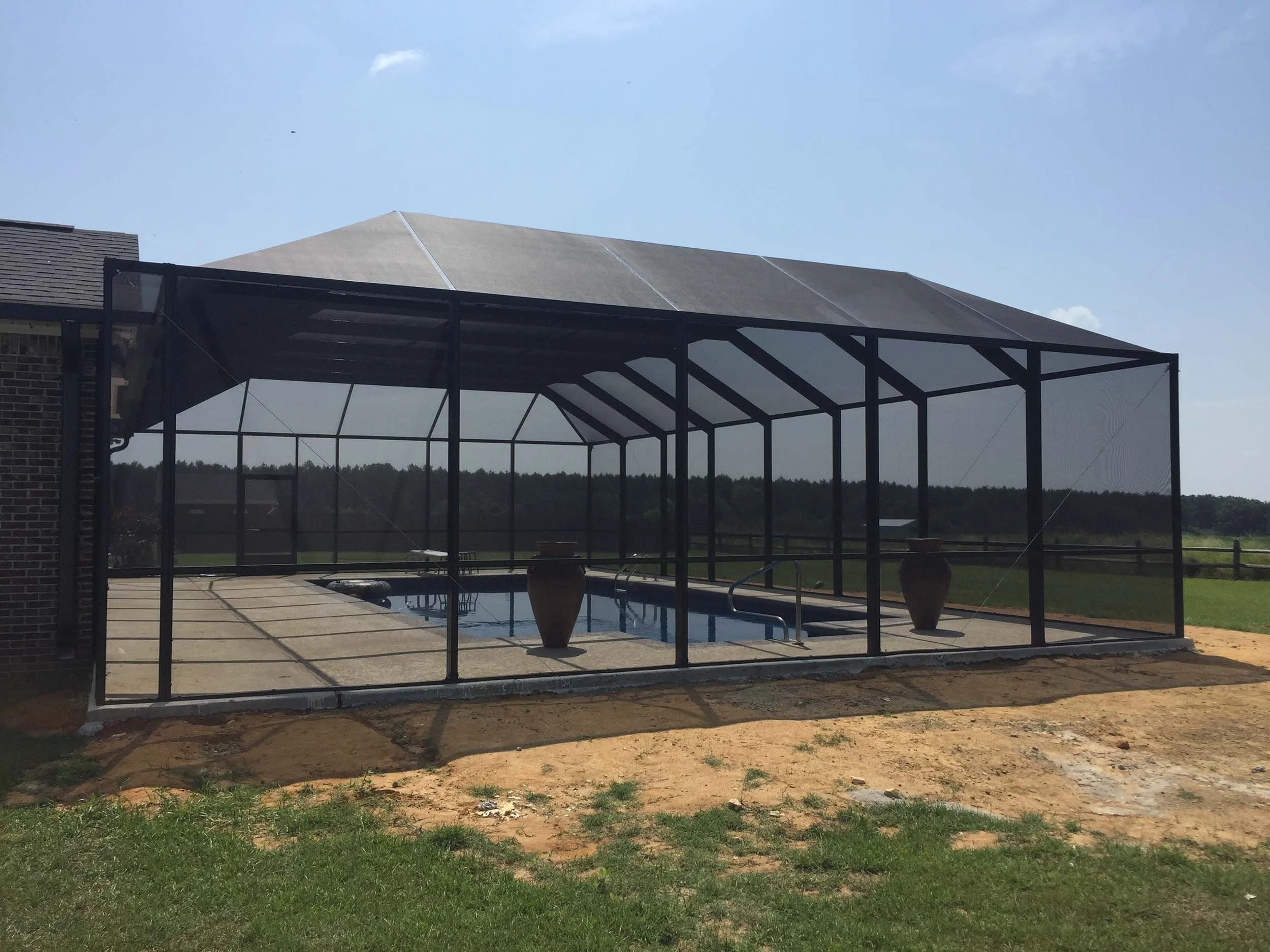 Durable pool cage installation designed for long-lasting outdoor enjoyment.