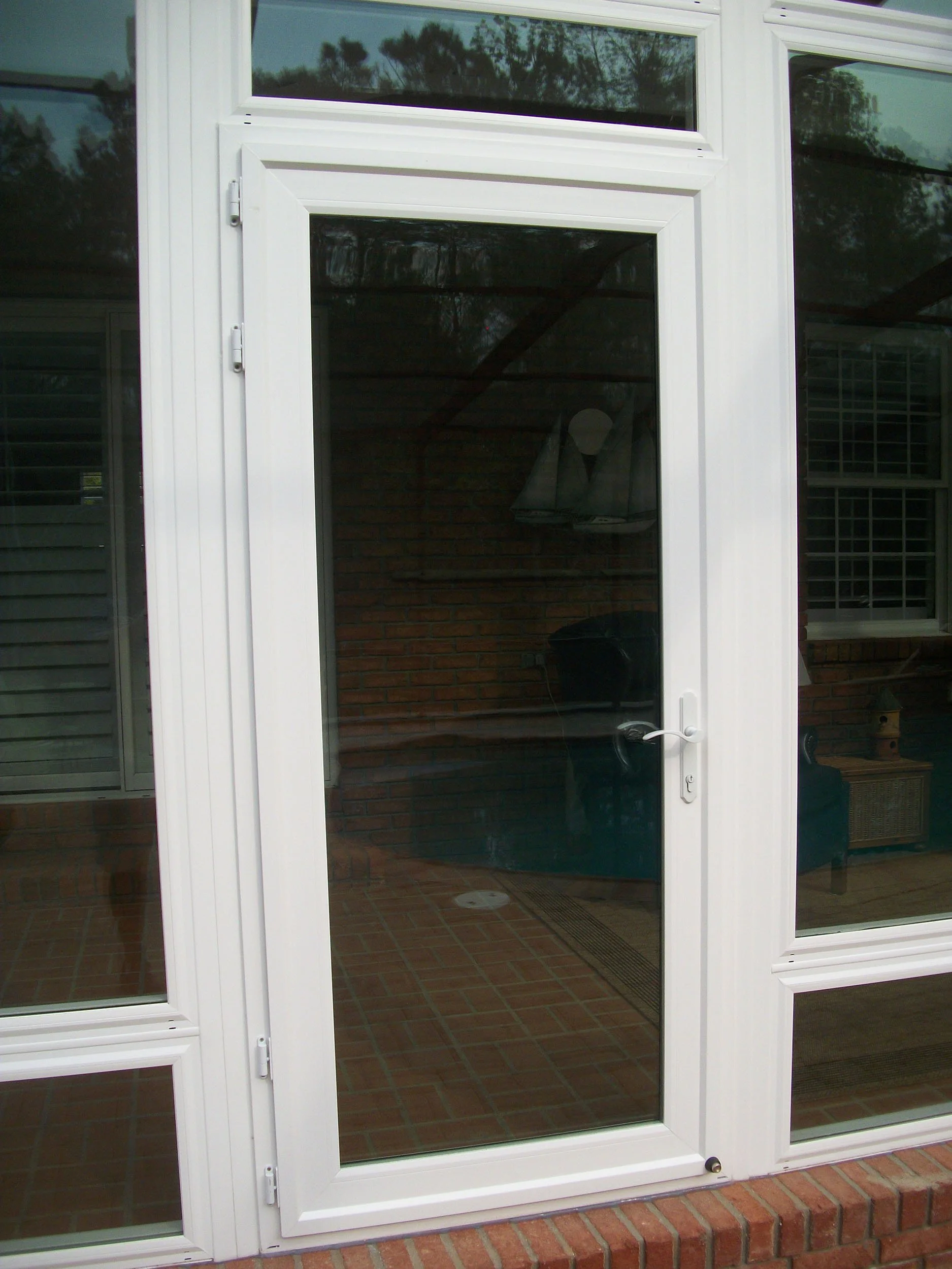 Custom replacement door by Hathcock Home Services for a more welcoming home exterior.