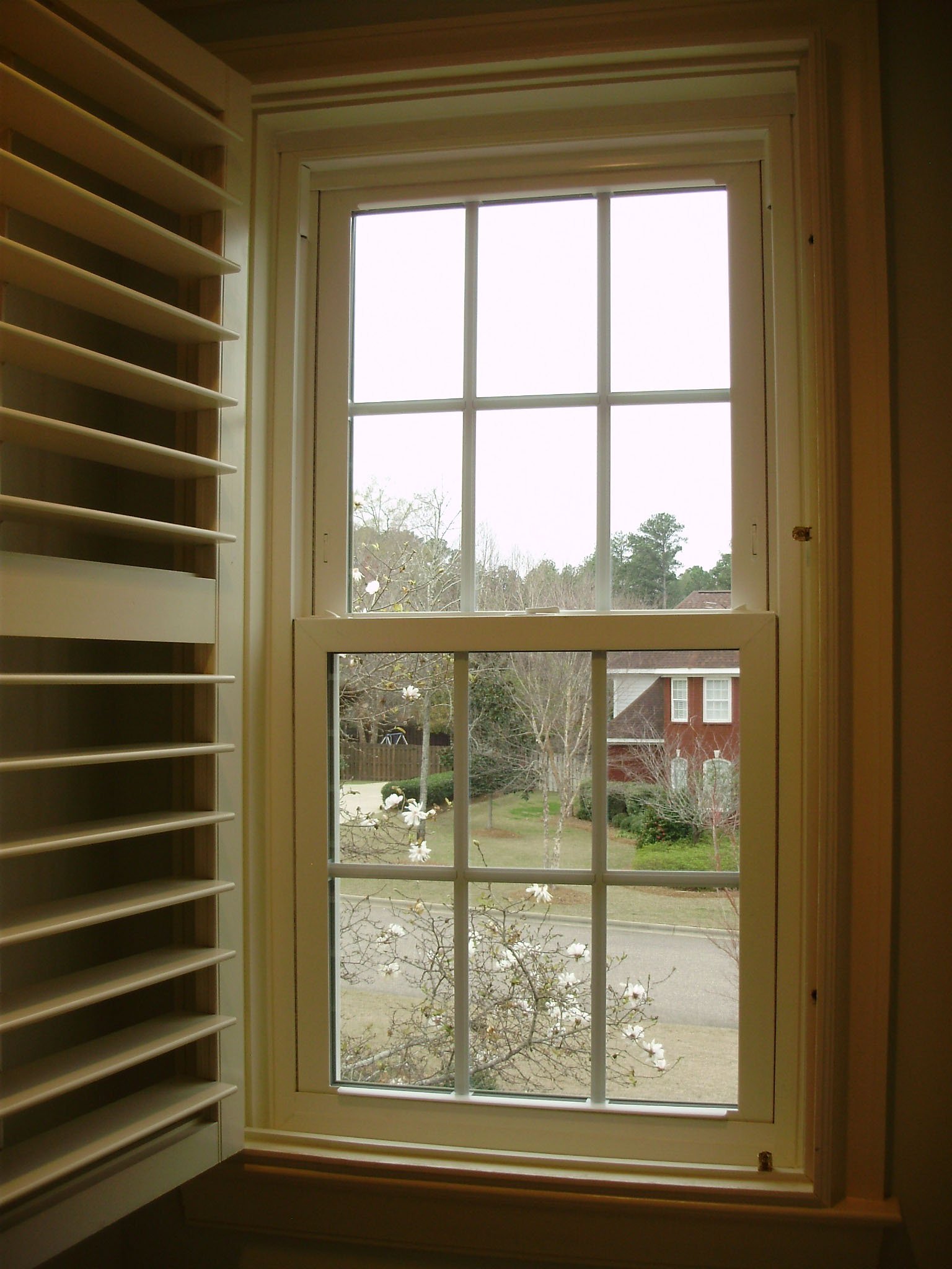 White replacement windows with divided lites for a residential home.