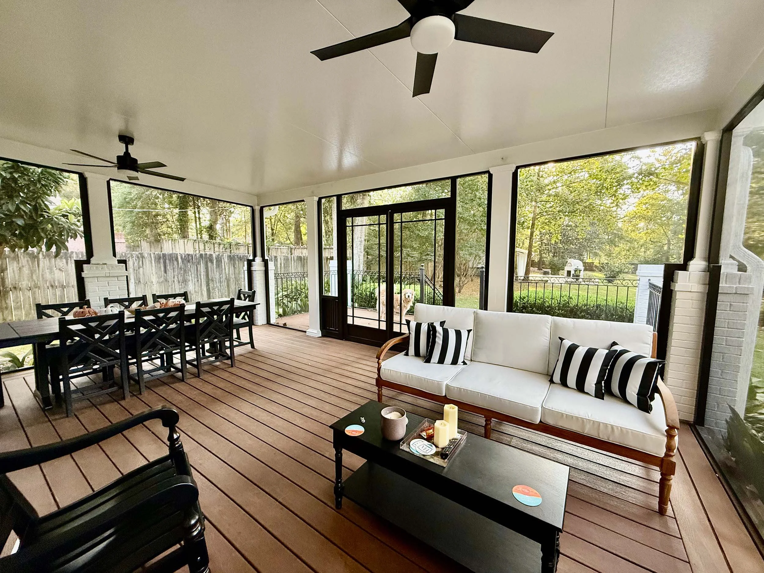 Enclosed patio screenroom designed for year-round outdoor enjoyment.