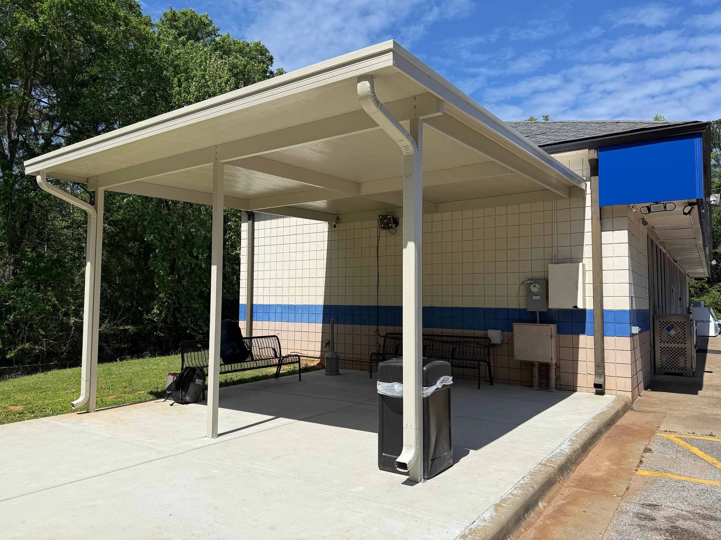Commercial canopy installation designed to protect walkways, windows, and entry areas.