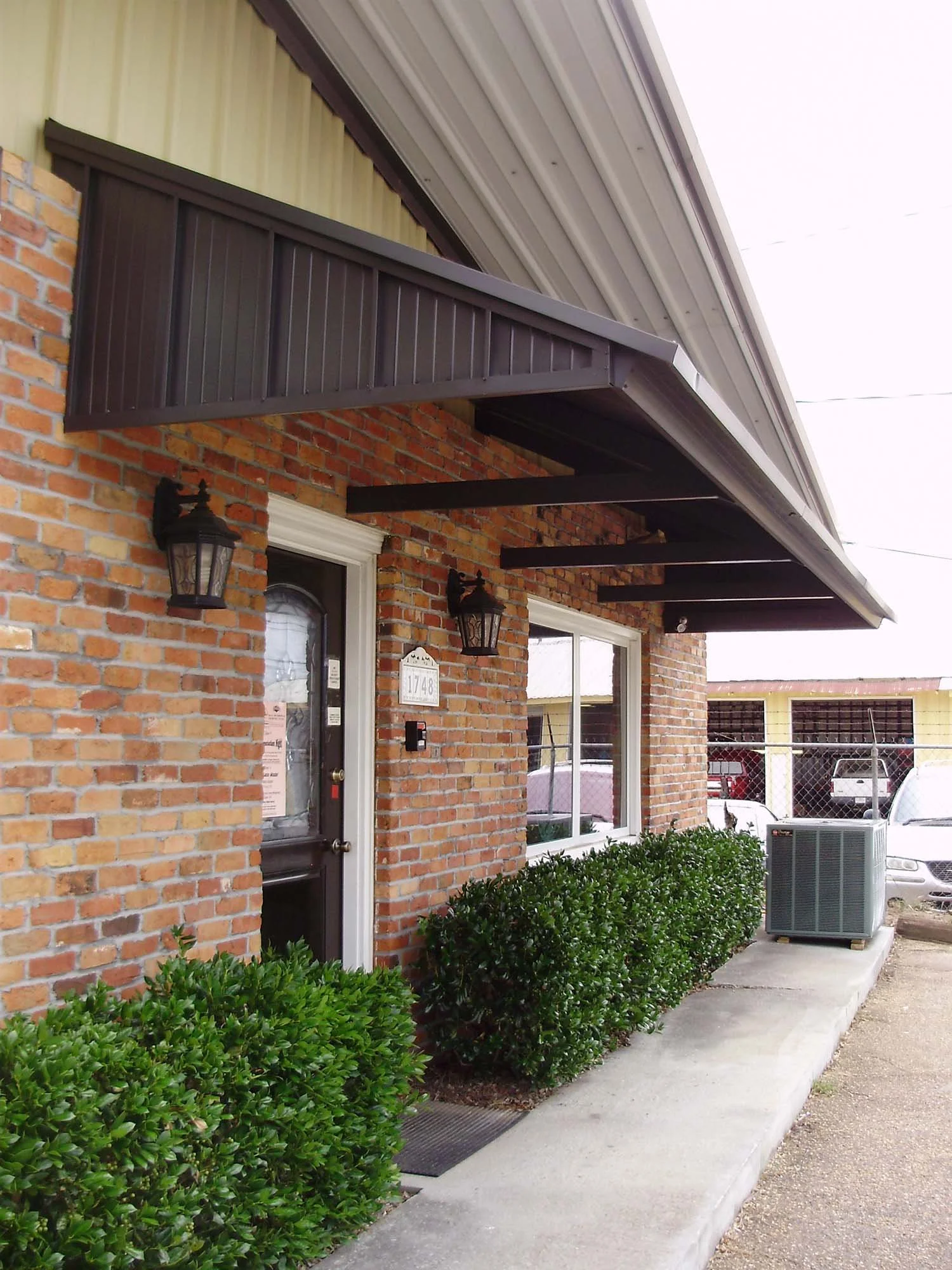 Storefront awning project for improved business visibility and customer comfort.