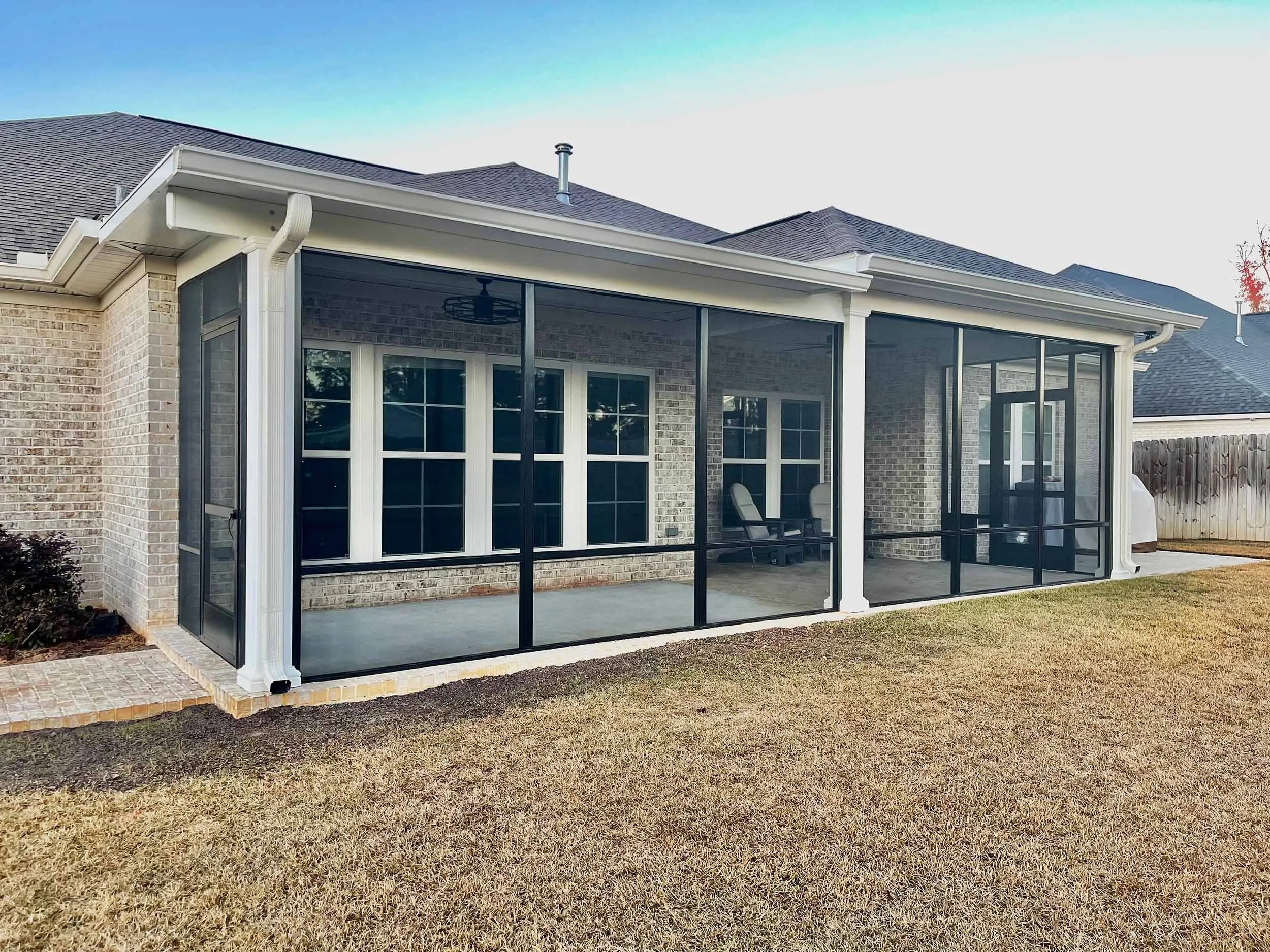 Screenroom addition built to improve home comfort and outdoor function.