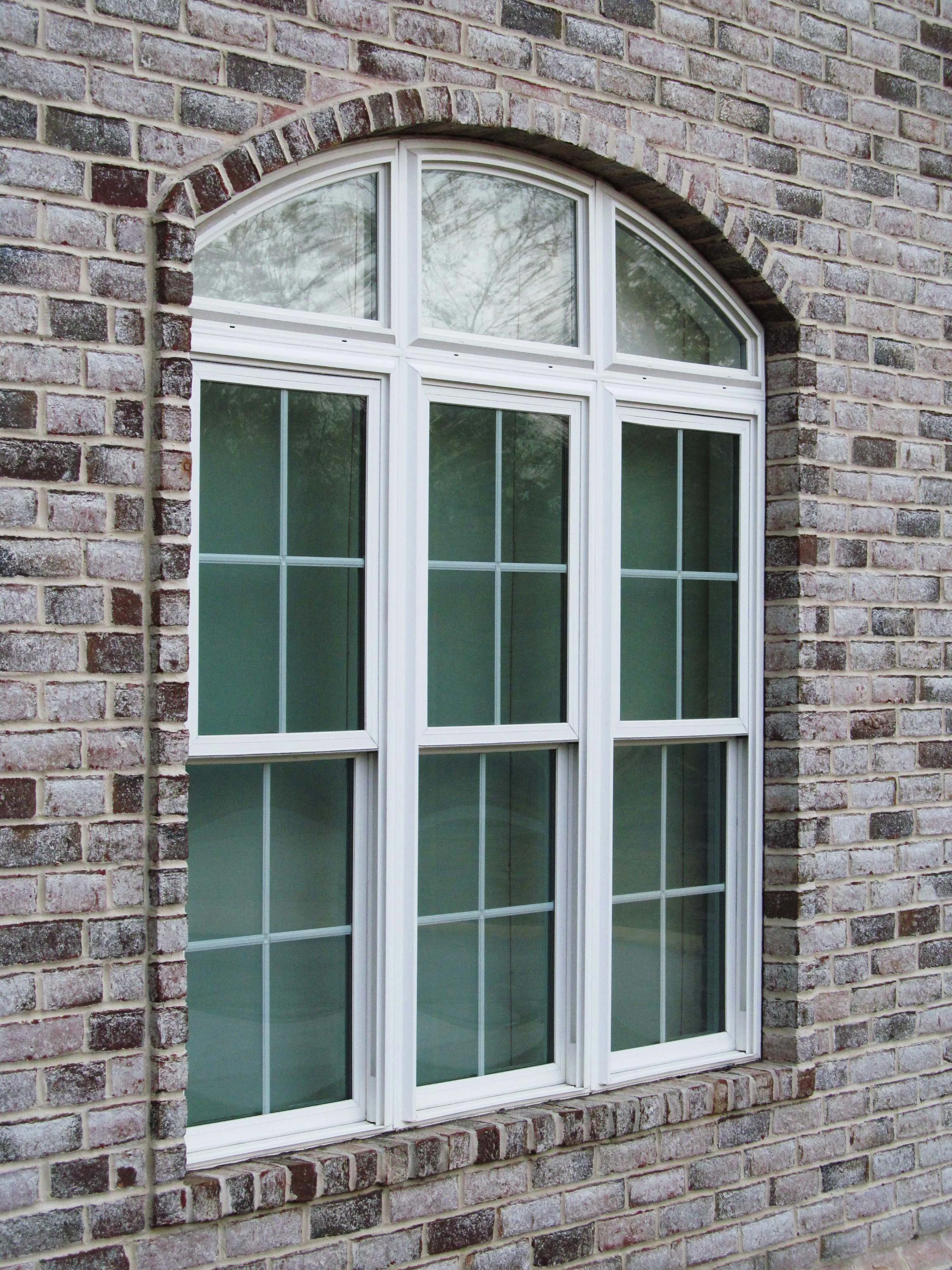 Arched replacement window installation in Dothan, AL.