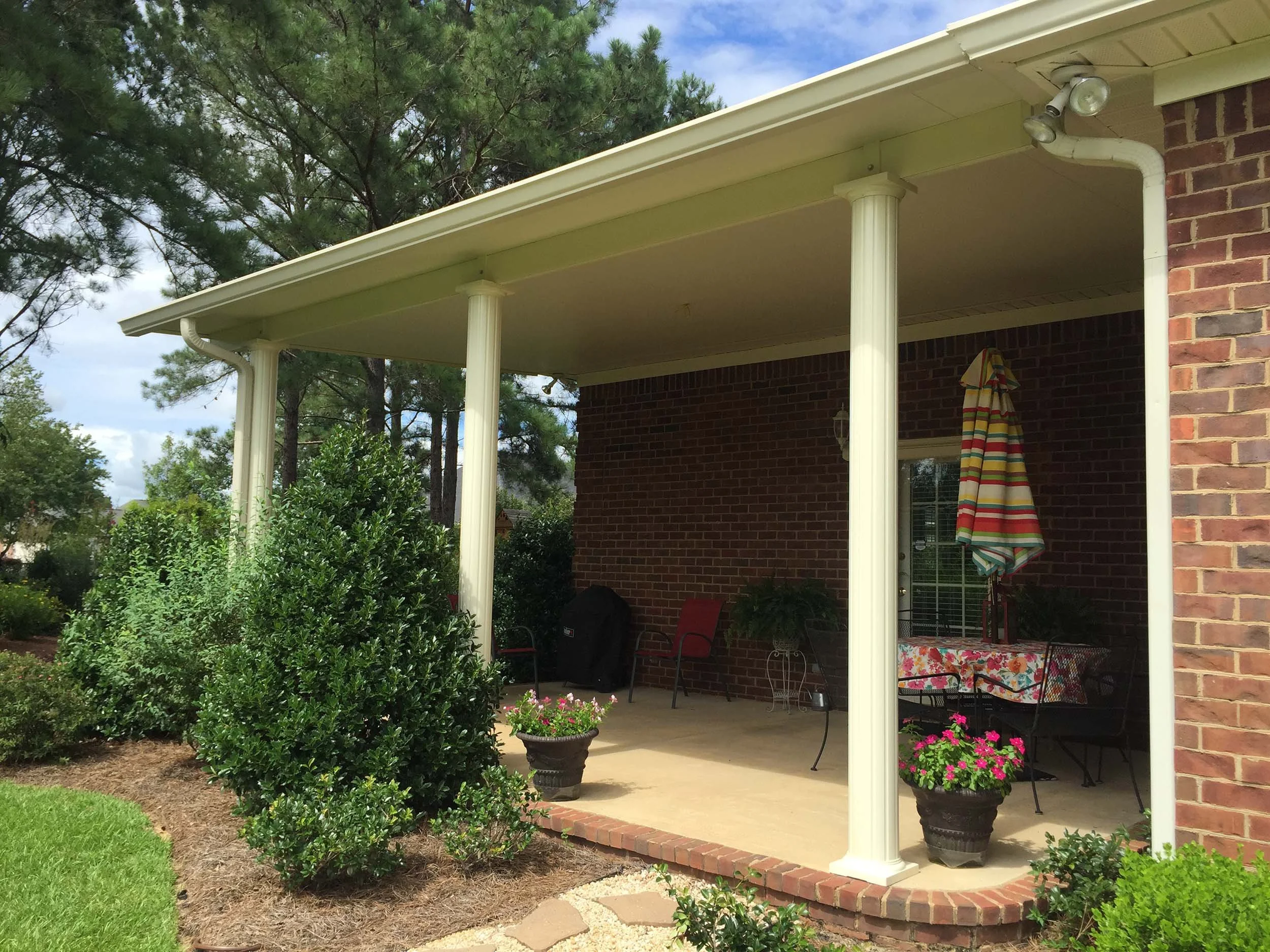 Custom awning and patio cover designed to complement the home’s exterior.