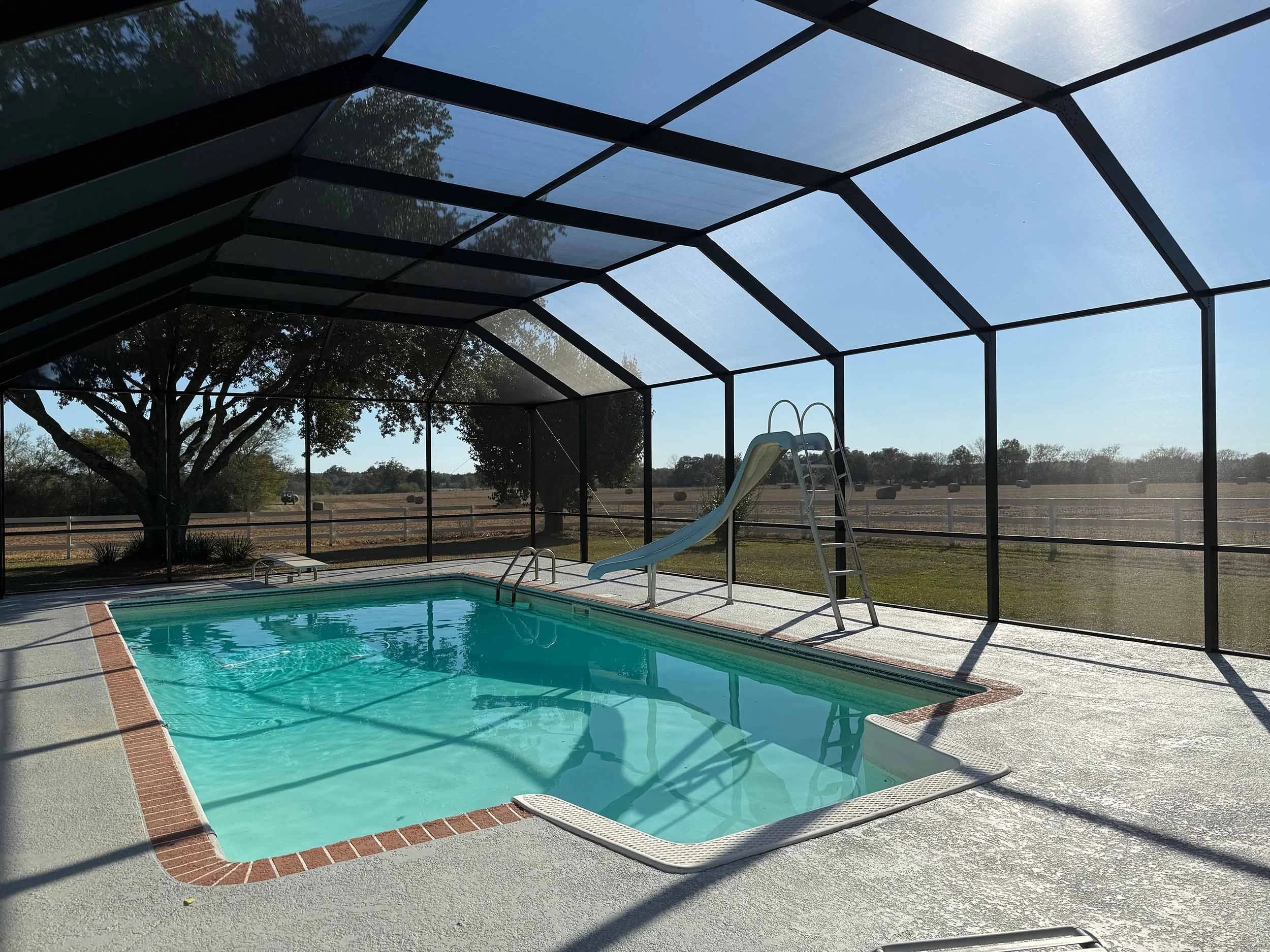 Custom pool enclosure installation by Hathcock Home Services in Dothan, Alabama.