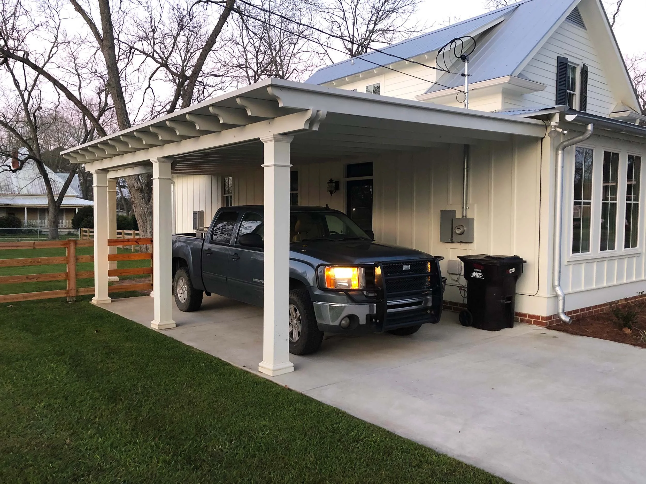 Attached carport installation providing convenient covered parking at home.