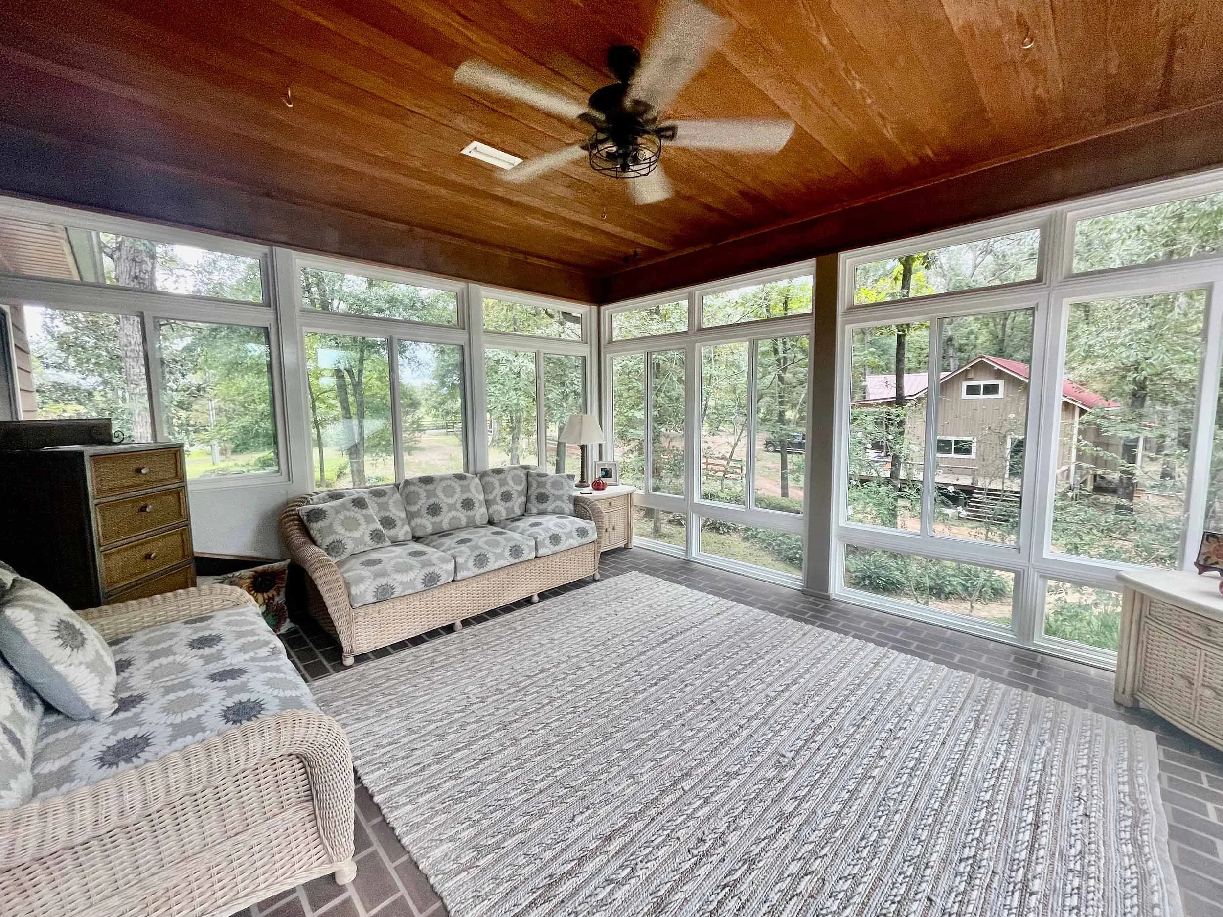 Custom sunroom addition for enjoying outdoor views with indoor comfort.